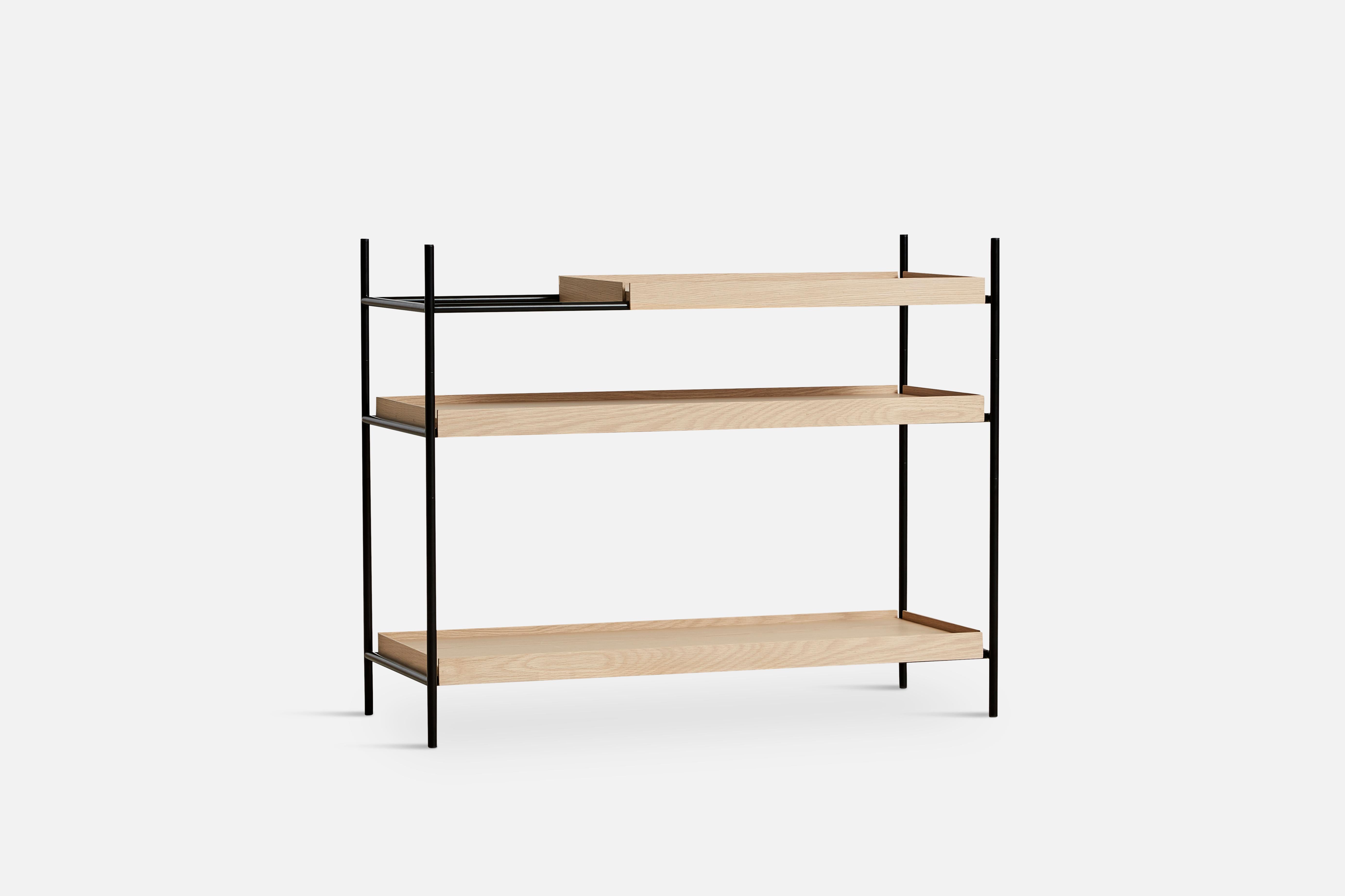 Low Oak Tray shelf by Hanne Willmann.
Materials: Metal, oak.
Dimensions: D 40 x W 100 x H 81 cm.
Also available in different tray conbinations and 2 sizes: H81, H 201 cm.

Hanne Willmann is a dynamic German designer with her own
