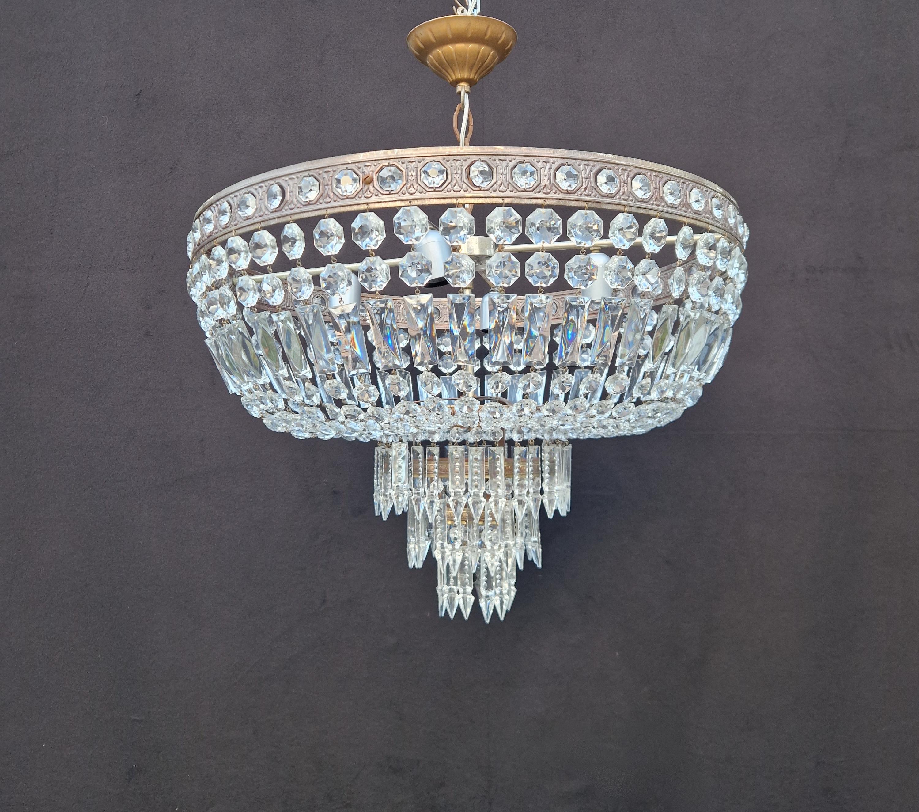 Introducing our cherished old chandelier, lovingly and professionally restored in Berlin. Its electrical wiring is fully compatible with the US, as it has been re-wired and is ready to hang. Not a single crystal is missing, and each one has been