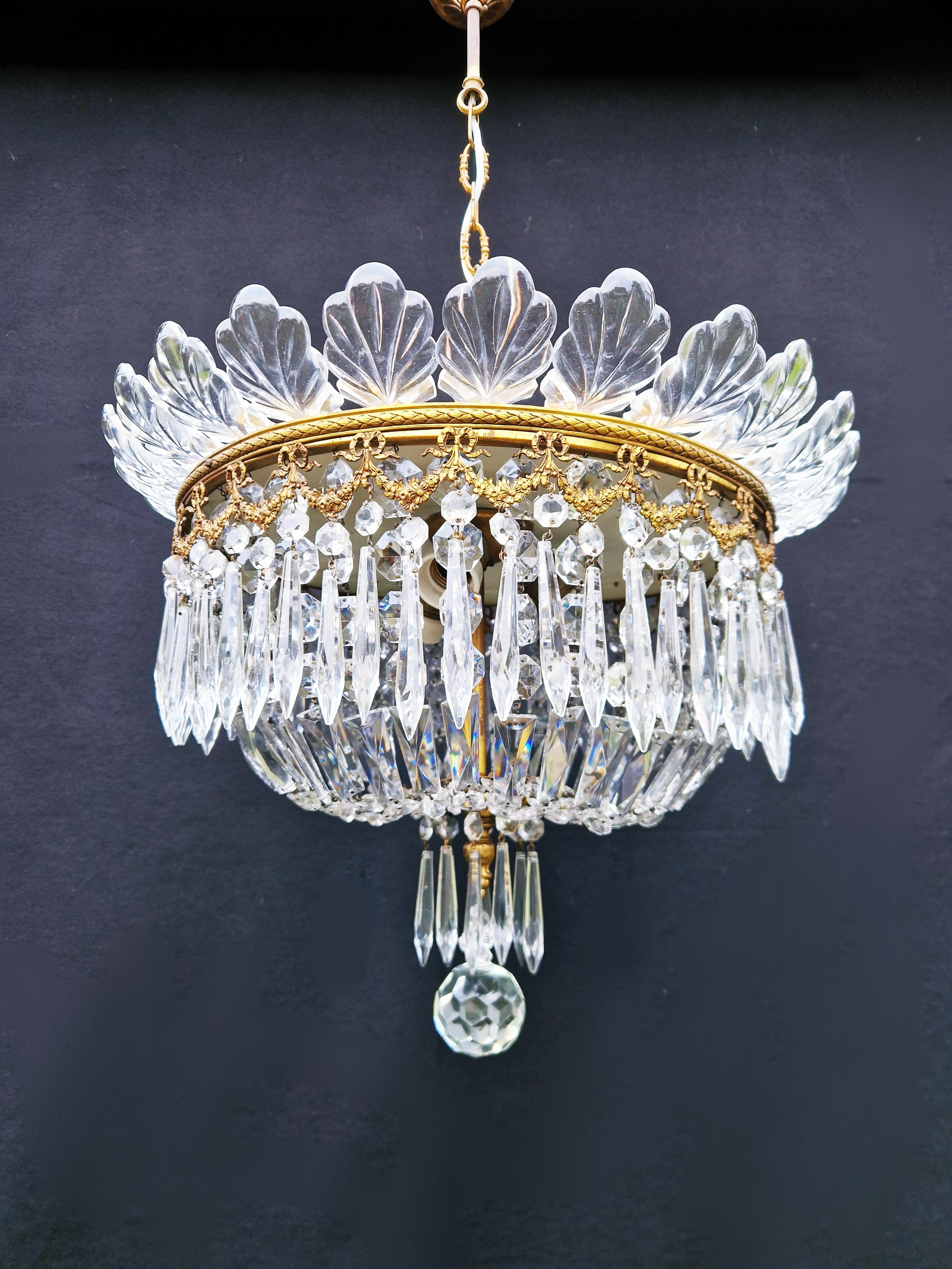 Introducing our beloved old chandelier, restored with love and expertise in Berlin. Its electrical wiring is compatible with the US, as it has been professionally re-wired and is ready to hang. Not a single crystal is missing, and the cabling has