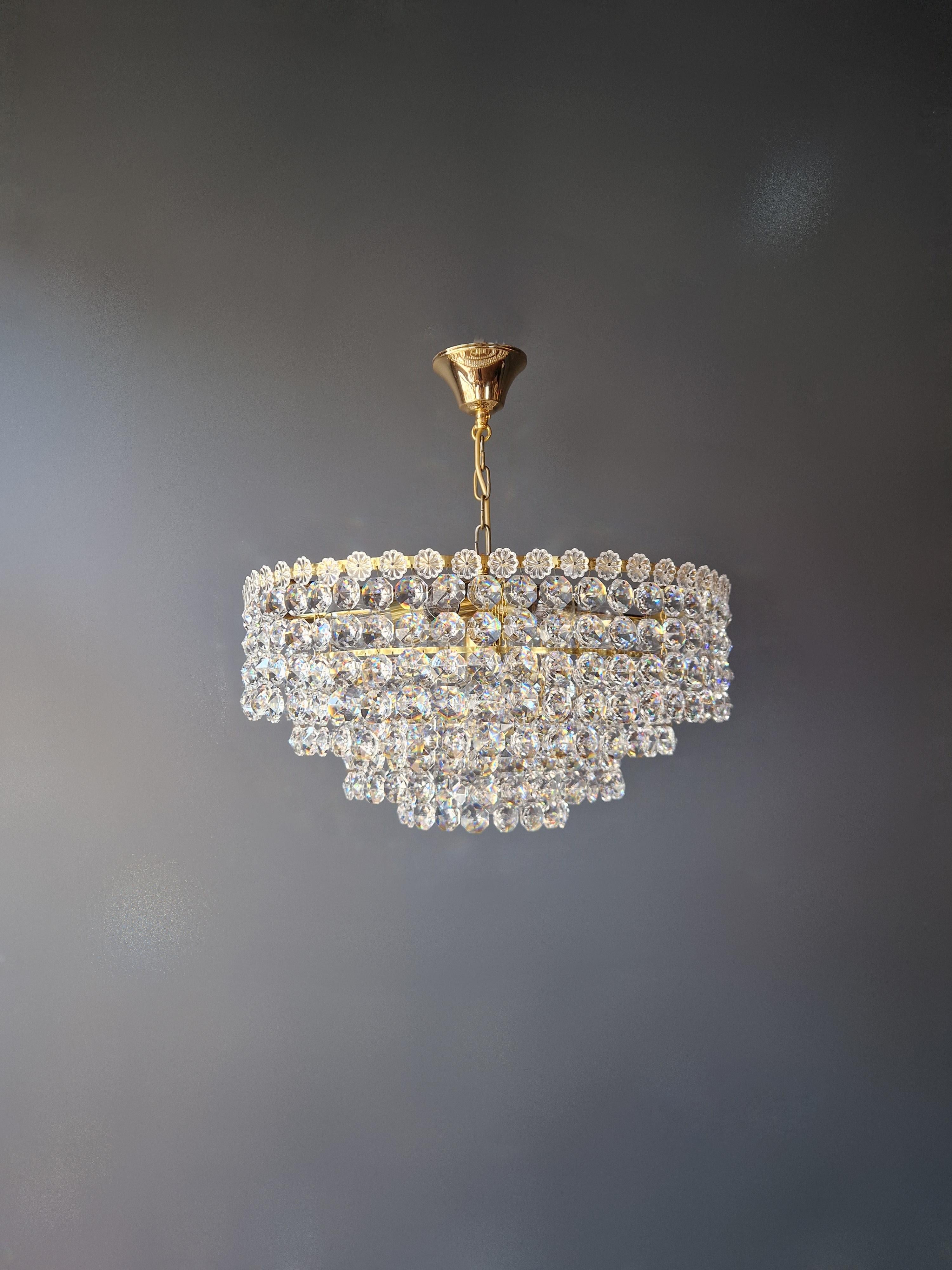 For sale is a delightful old chandelier, restored with care and expertise in Berlin. The electrical wiring is compatible with the US, as it has been completely re-wired and is ready to be hung. Every crystal has been meticulously hand-knotted,