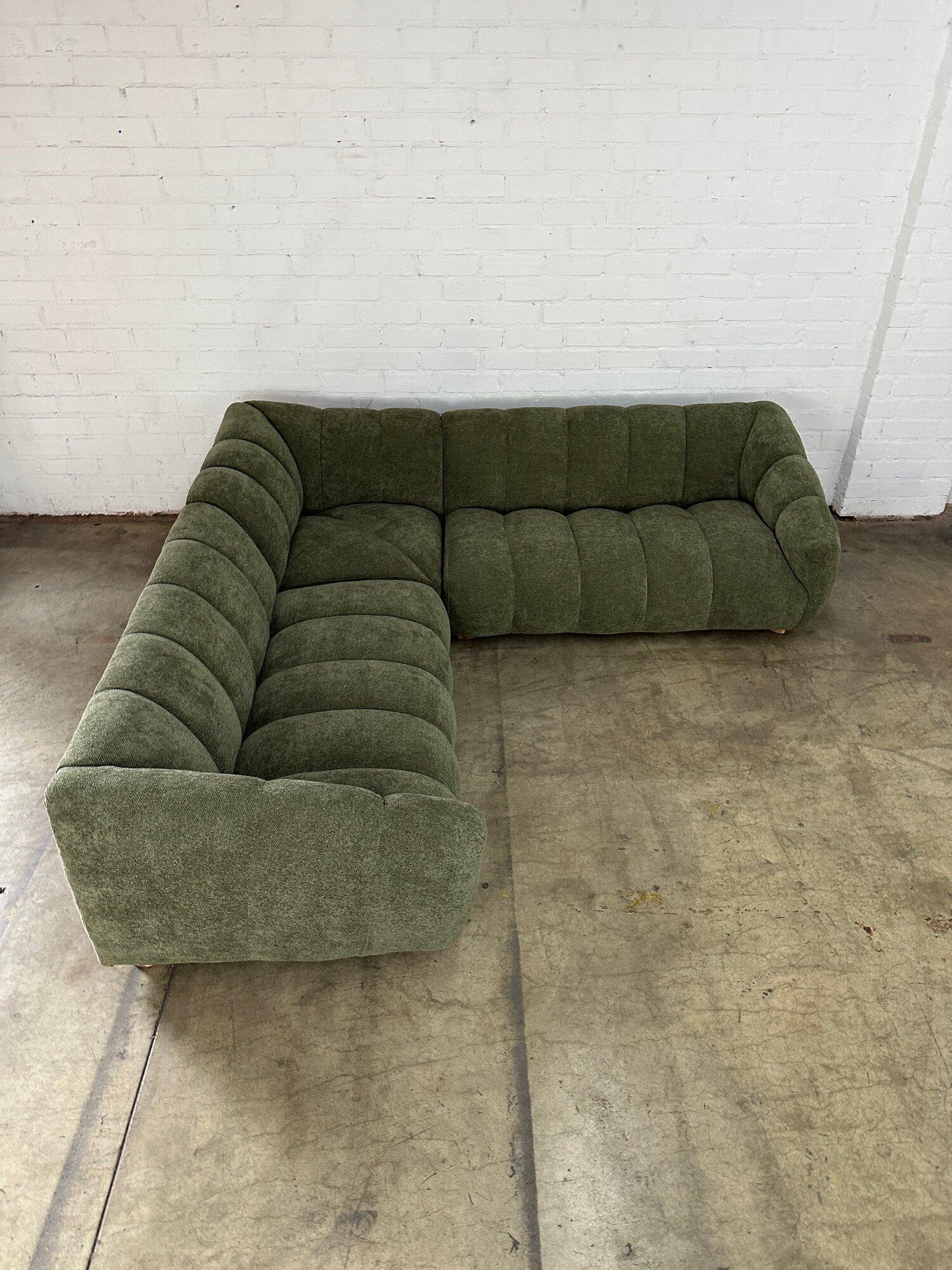 W96 D96 H26 SW75 SD24 SH13 AH22

Handcrafted sectional sofa made from scratch in house. Each unit is completely modular and feature both feather and foam for great comfort. Item has green nubby boucle and sit on low solid white oak legs. Price is