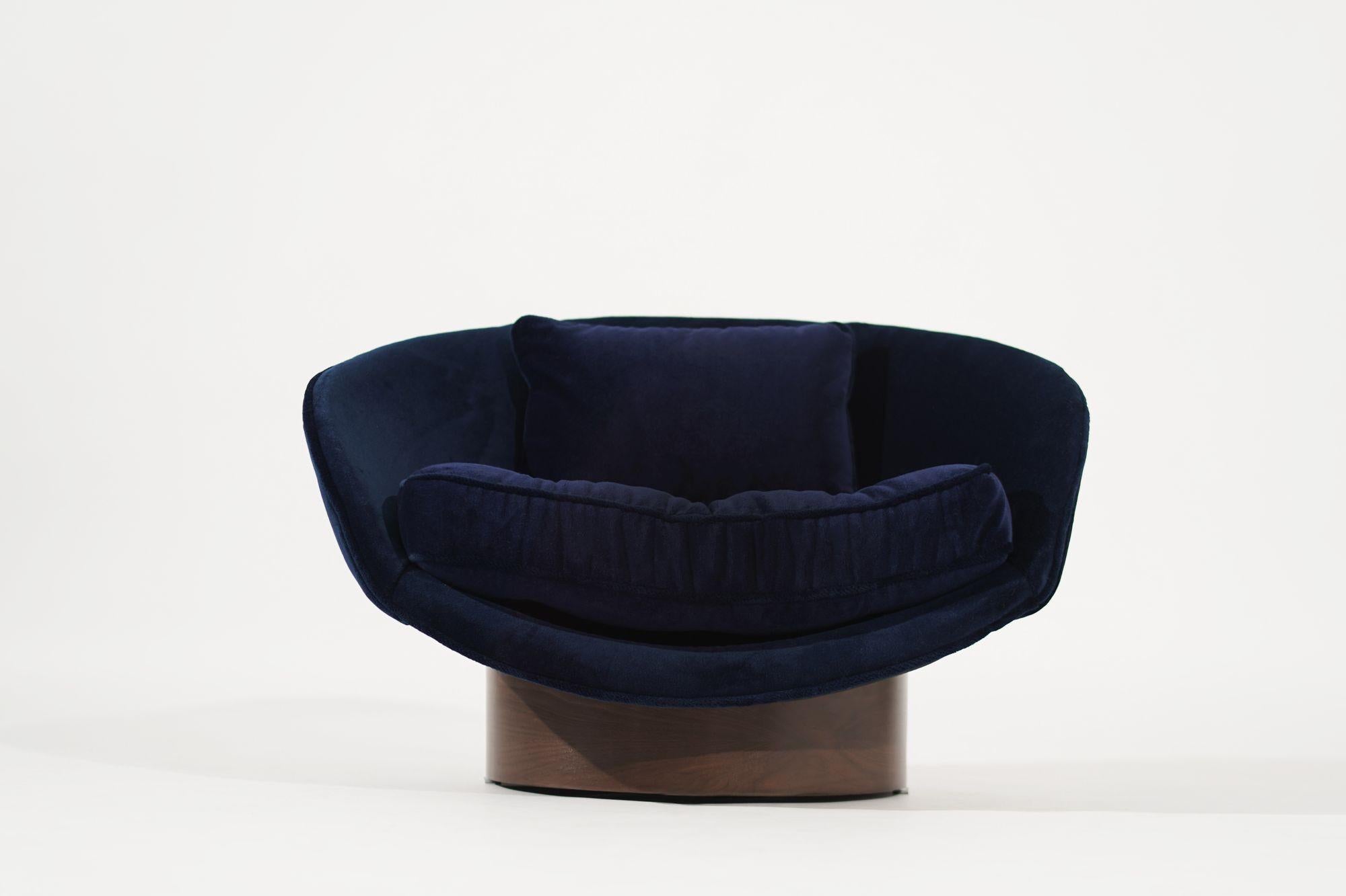 A meticulously restored low profile chair by Adrian Pearsall. Fully revived to its original splendor, this chair boasts impeccable navy blue alpaca velvet upholstery, reflecting both vintage allure and enduring quality. With its sleek lines and