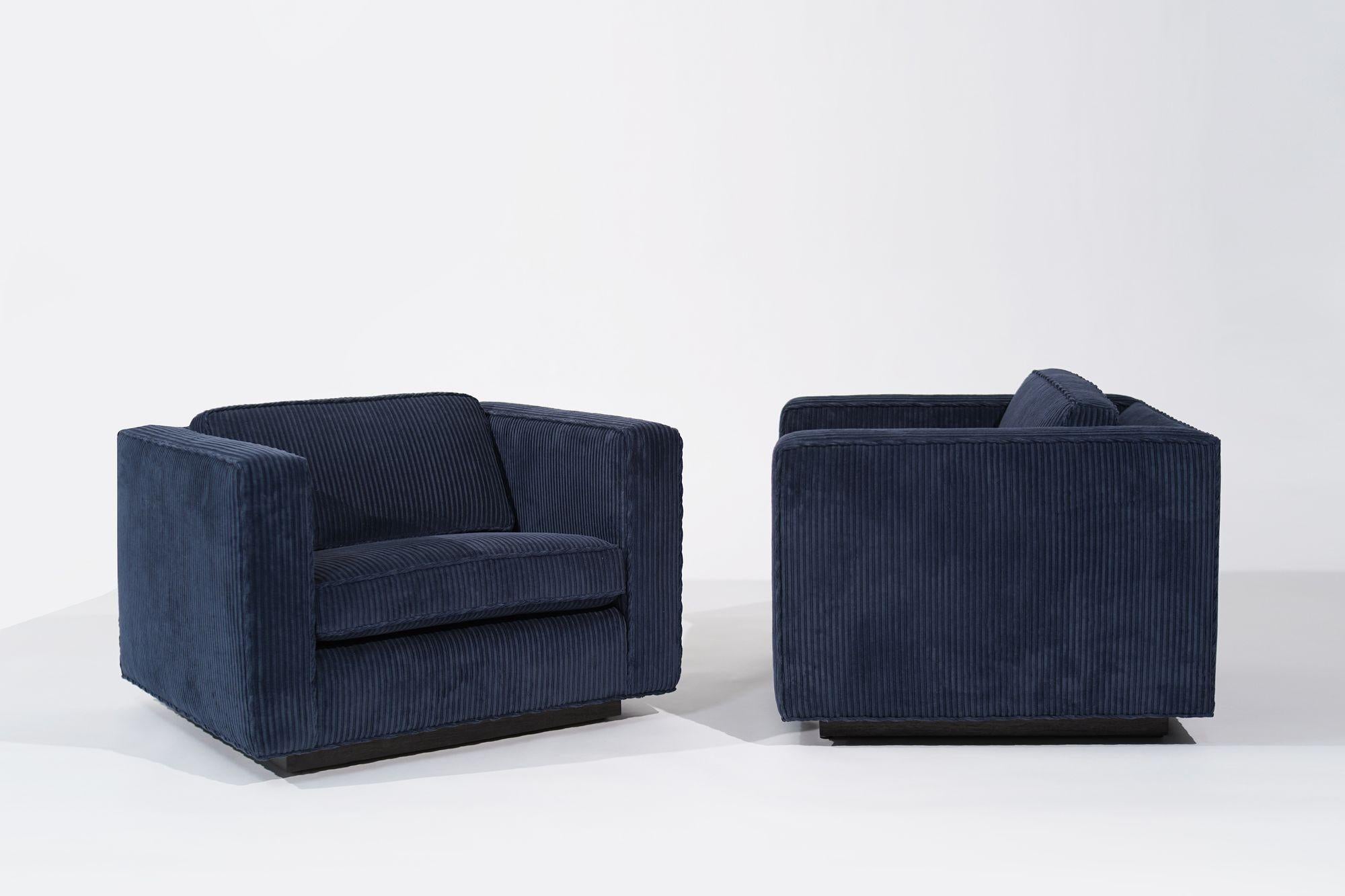 Fully restored Low Profile Lounges by Milo Baughman, circa 1970s. This iconic pair has been meticulously revitalized and reupholstered in a luxurious navy blue corduroy fabric by Holly Hunt, seamlessly blending mid-century charm with modern comfort.