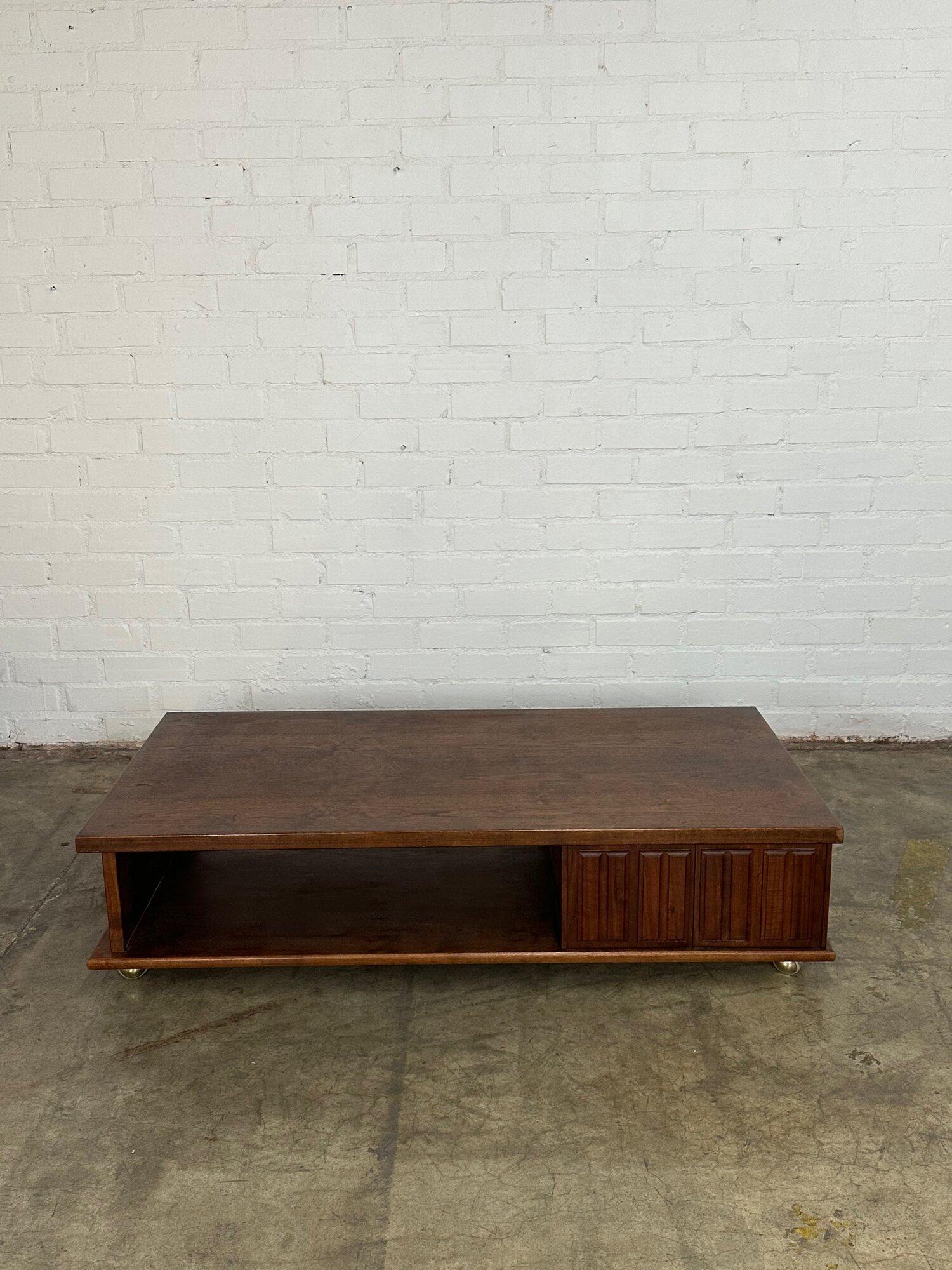 W60 D30 H14

Solid walnut low profile coffee table on brass plated casters. Item is in structurally sound and sturdy condition. Item is in great AS FOUND condition. Minor areas of wear have been closely pictured but overall item shows well and is