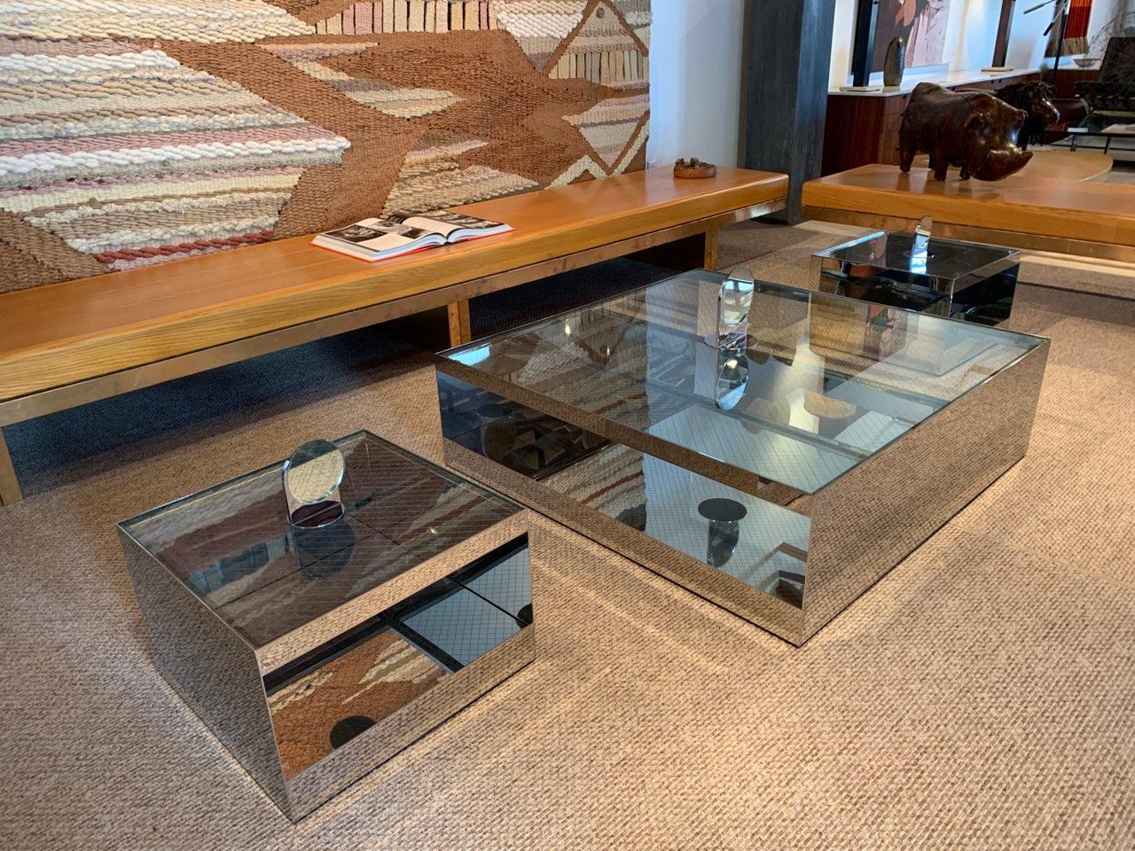 Low rolling coffee table Model 6048T designed by legendary Joeseph D'Urso for Knoll - 1981. Constructed of mirror polished stainless steel and diamond wire safety glass on hidden castors. Table is in excellent condition with the original safety