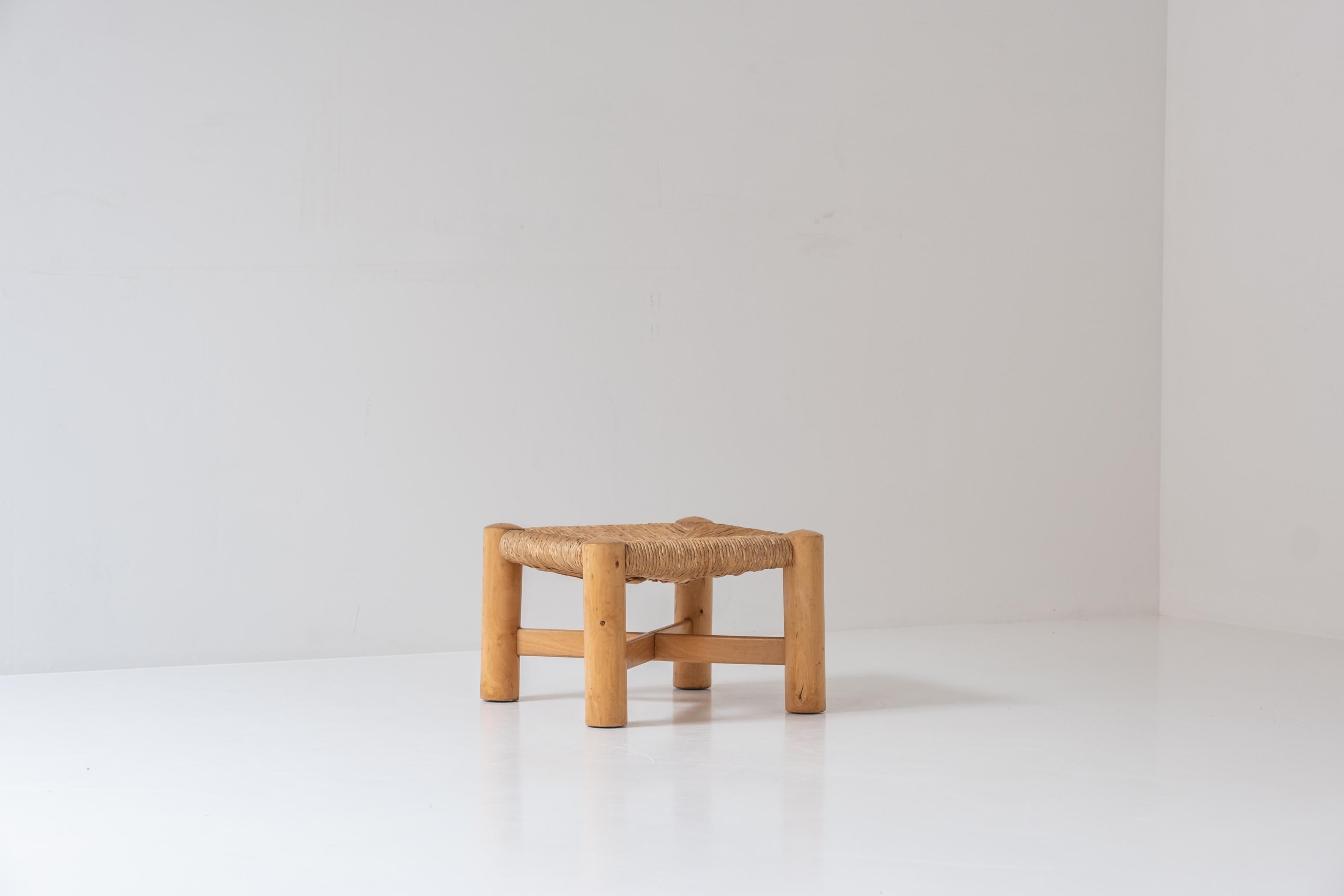 Nice low rush stool by Wim den Boon, designed and manufactured in the Netherlands during the 1950s. This piece is made out off a solid beech wood base and rush seat. The stool is in a very good authentic condition with only minor wear from age and