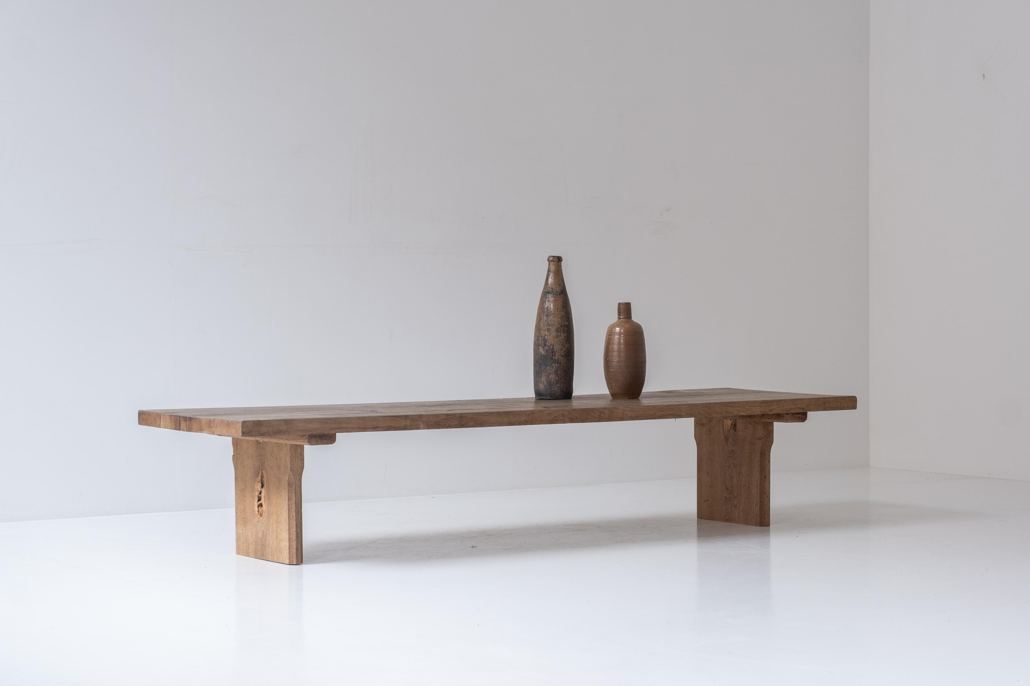 Great low rustic coffee table from France, designed and handmade in the 1950s. This coffee table is made out of solid elm and has an overall gorgeous patina.