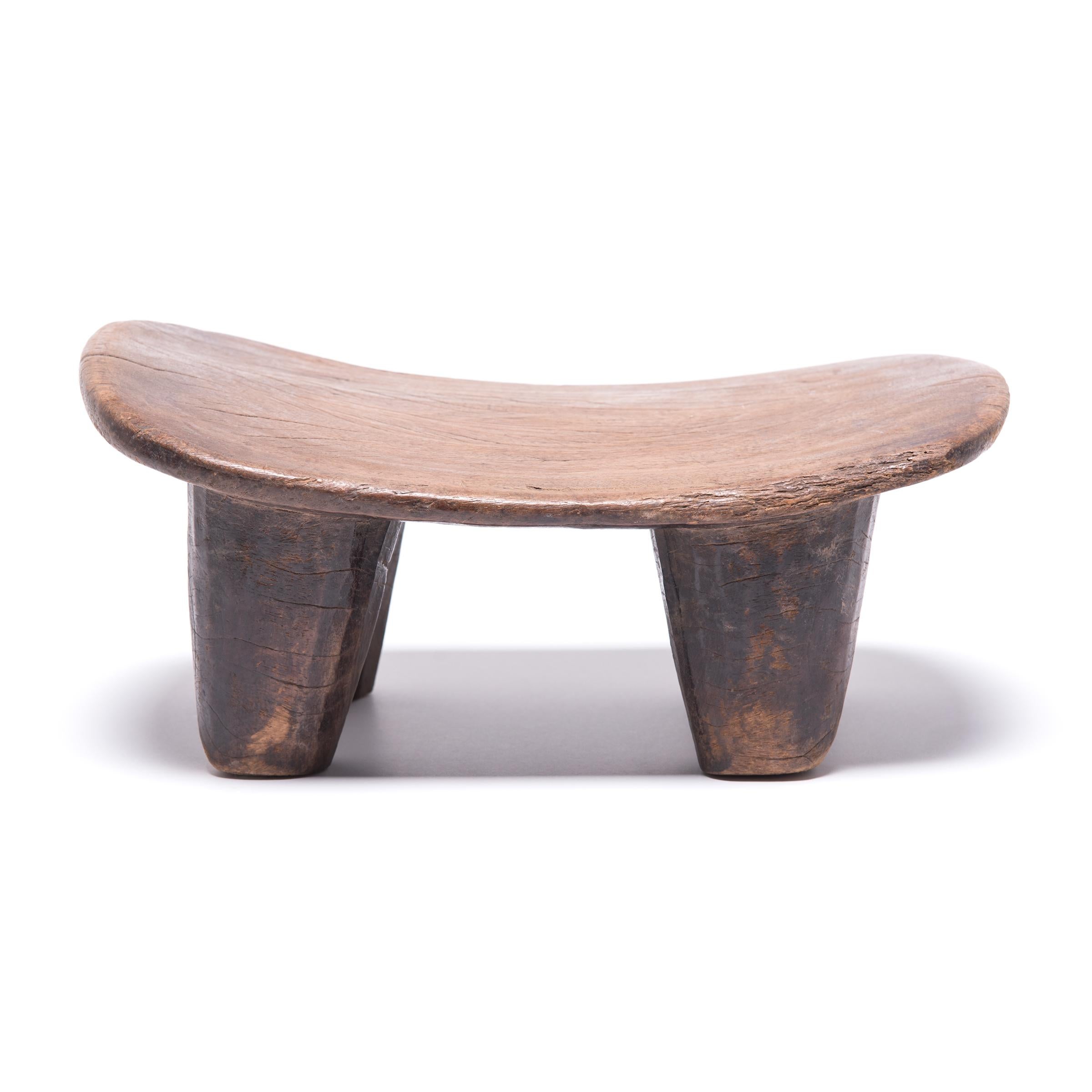 Hand-carved from a single, solid block of wood, each Senufo stool retains a unique personality as a modern sculpture, seat or table. The irregular strokes and diminutive nature are telltale signs of this traditional woodcarving practice. The
