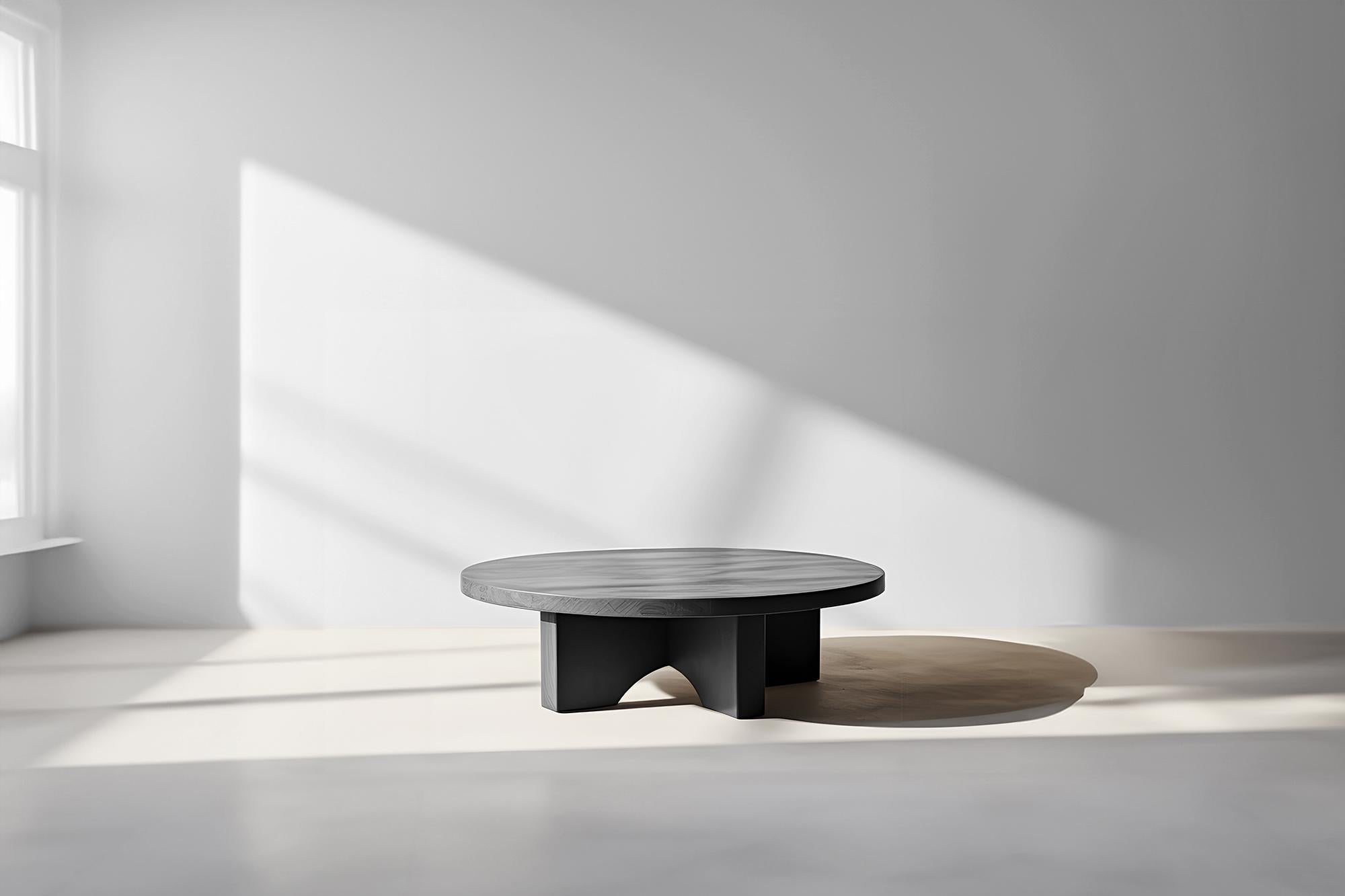 Low-Set Round Coffee Table - Dark Finish Fundamenta 42 by NONO

Sculptural coffee table made of solid wood with a natural water-based or black tinted finish. Due to the nature of the production process, each piece may vary in grain, texture, shape