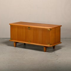 Low Sideboard in oak and brass brackets designed by Henning Kjærnulf, Denmark
