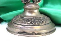 Low silver candelabra with two lights and shell-relief circular bases