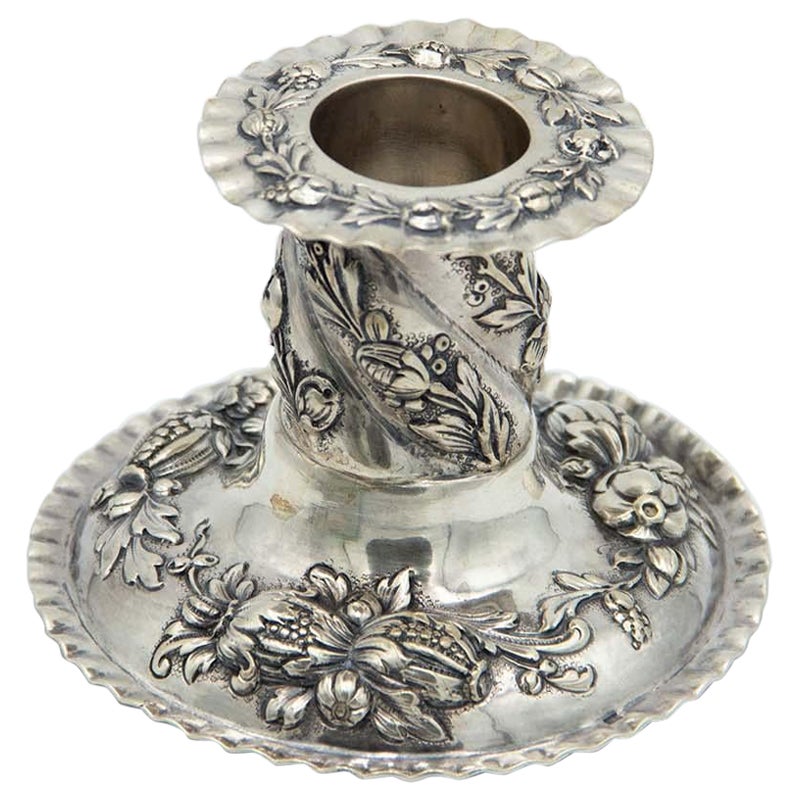 Low silver candlestick with circular base