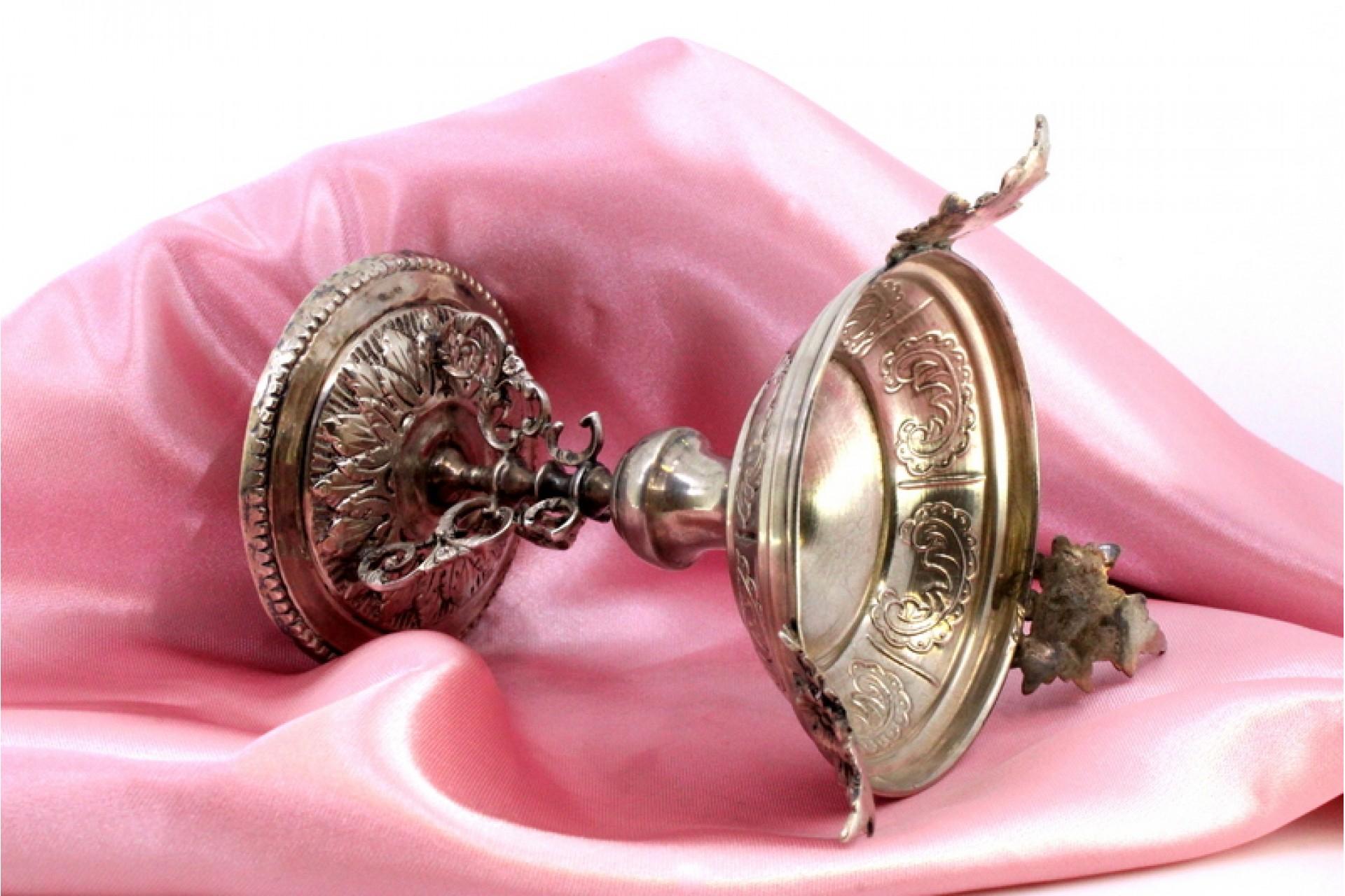 European Low silver candlestick with relief engravings on round base with three legs For Sale