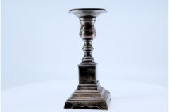 Low silver candlestick with square shaft and base