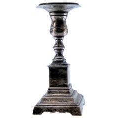 Low silver candlestick with square shaft and base
