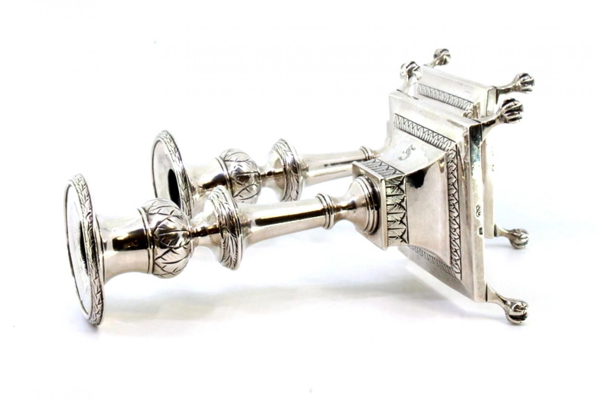 Low silver candlesticks with engraved shafts and four claw-shaped feet For Sale 1