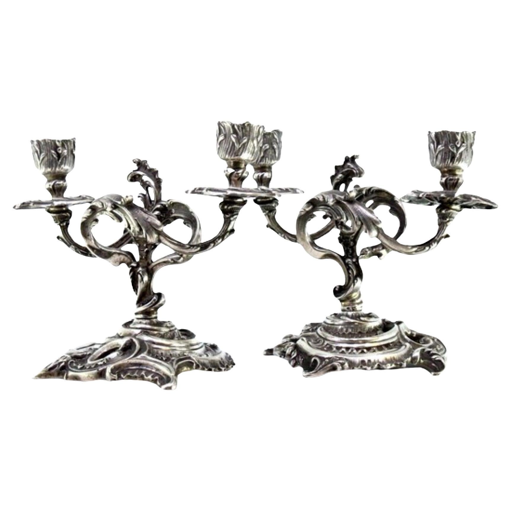Low silver two-light candelabra with shells, garlands and cut-out bases For Sale