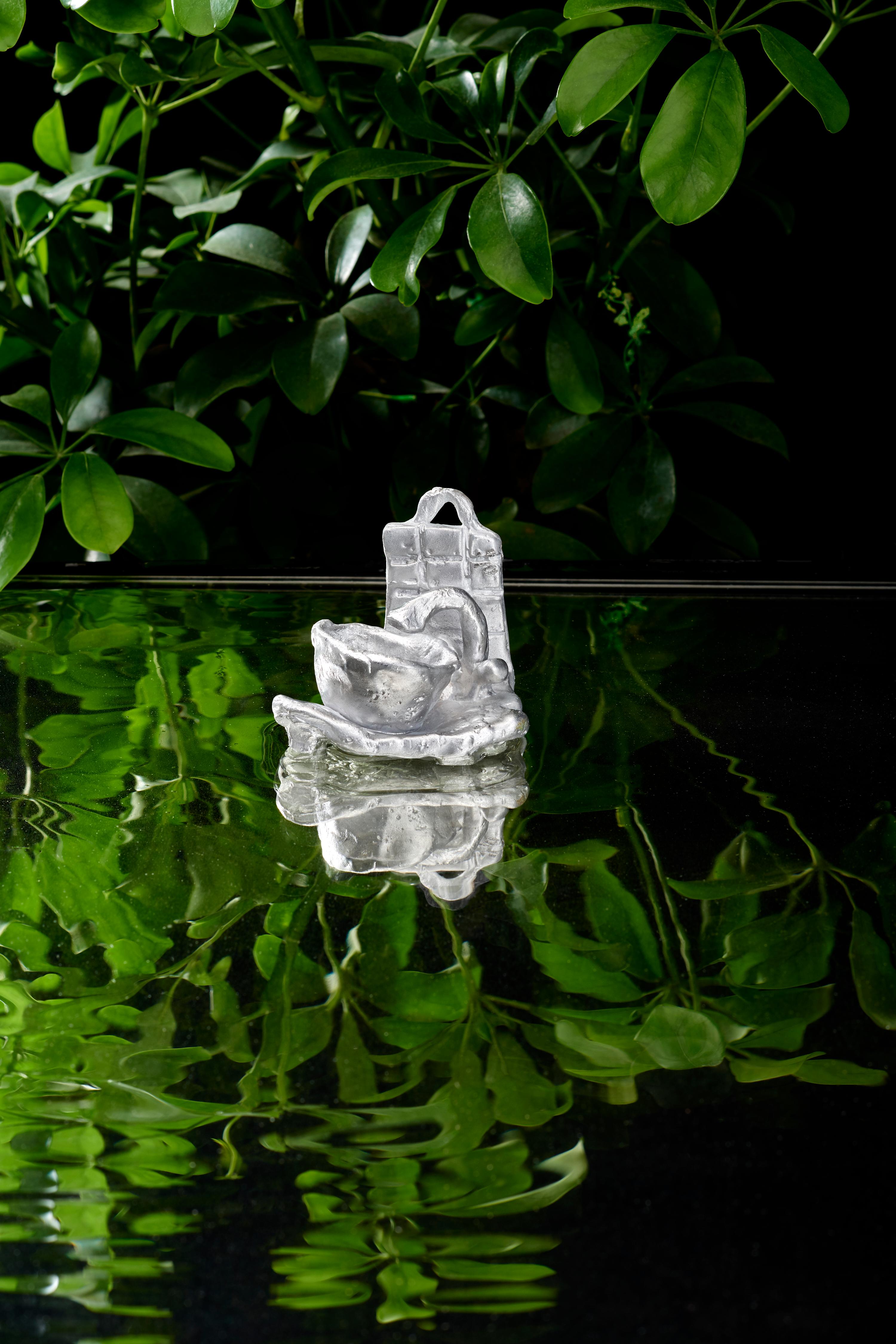 Unique, hand made, signed sculpture from the 'Oasis' series (2022) by Olga Flór. 
Hanging or standing piece made from bee wax and cast into aluminium.
Aluminium (139g)
Comes with a signed Certificate of Authenticity

The 'Oasis' series reveals the