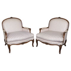 Low Slung Pair Carved Walnut French Carved Louis XV Bergere Chairs