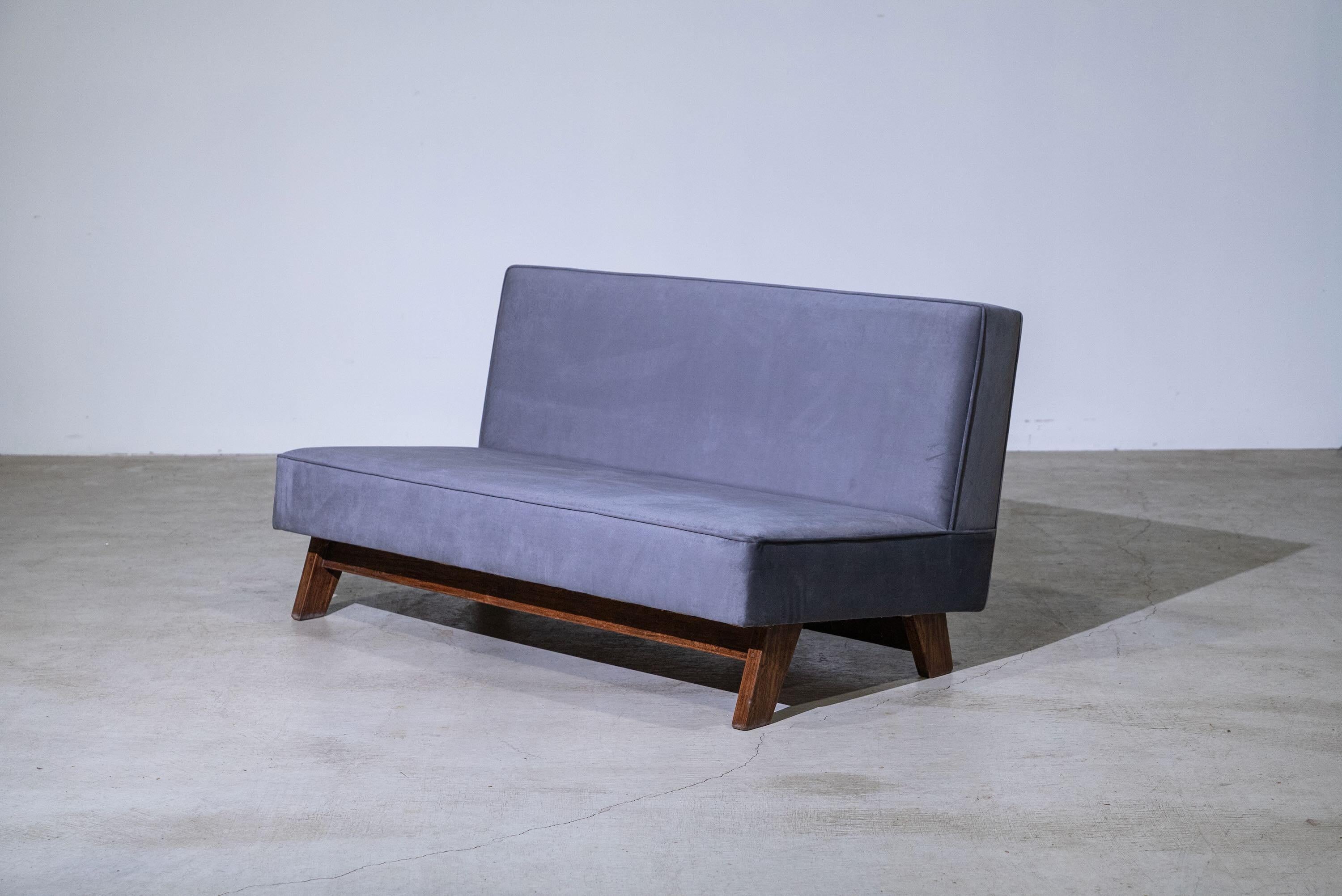 An authentic mid-century piece from Le Corbusier and Pierre Jeanneret’s legendary Chandigarh commission. Teak frame with fabric upholstered seat & back.