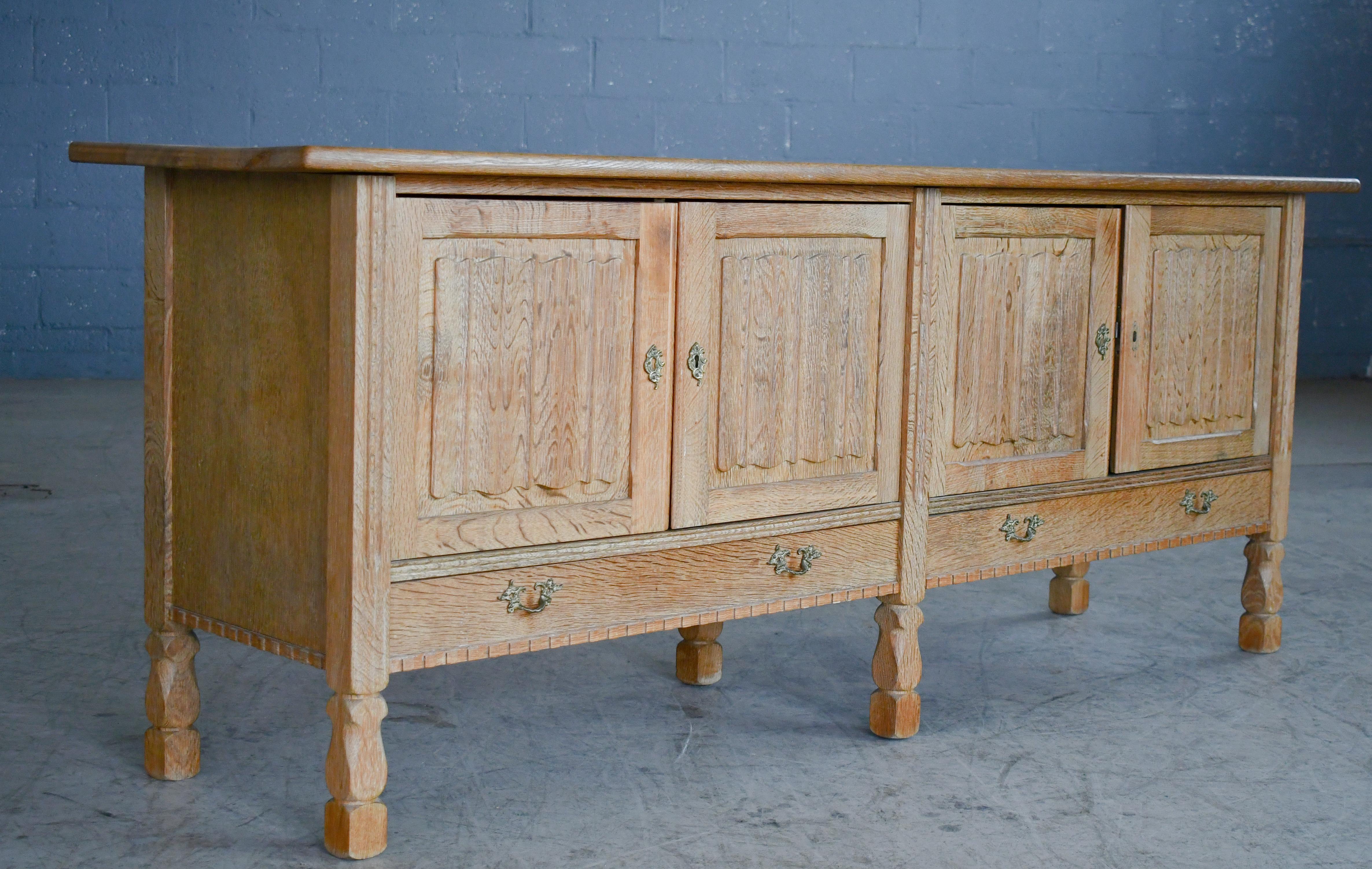 Scandinavian Modern Low Solid Carved Credenza in Oak by Henning Kjærnulf 60's For Sale