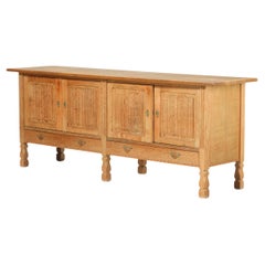 Low Solid Carved Credenza in Oak by Henning Kjærnulf 60's