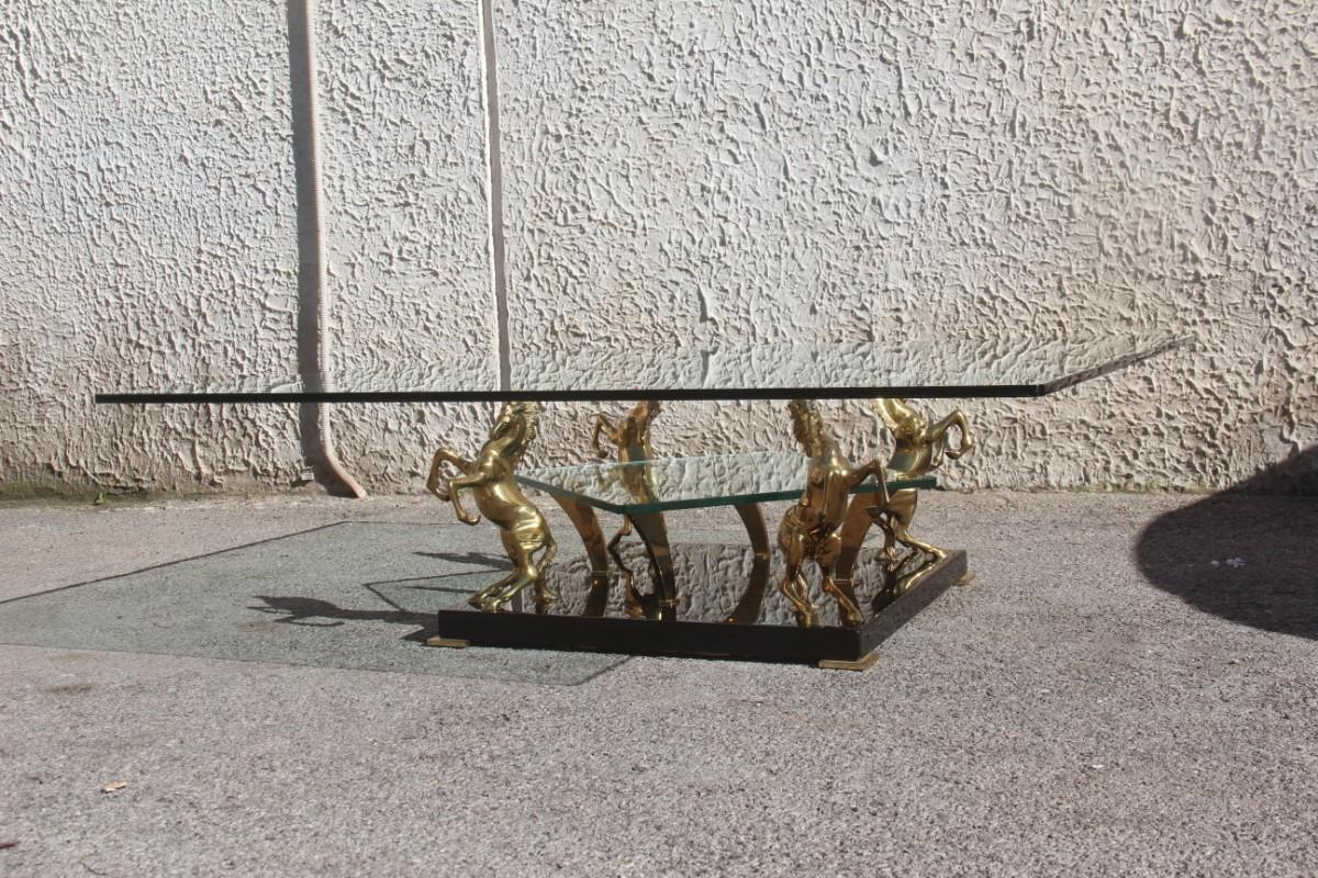 Low square glass coffee table and 24-karat golden brass horses 1970 Italian design, black and gold.
