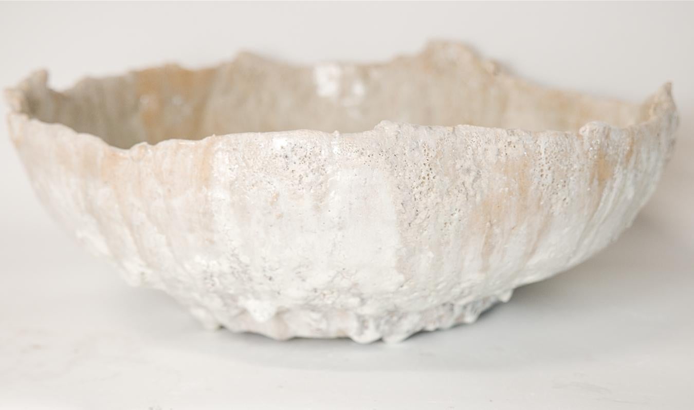 Discover the Relics Large Low Stoneware Planter Bowl, the perfect large sized bowl to use as a planter for orchids or other succulents on your table. This exquisite piece is handcrafted from stoneware clay and adorned with a matte off-white glaze,