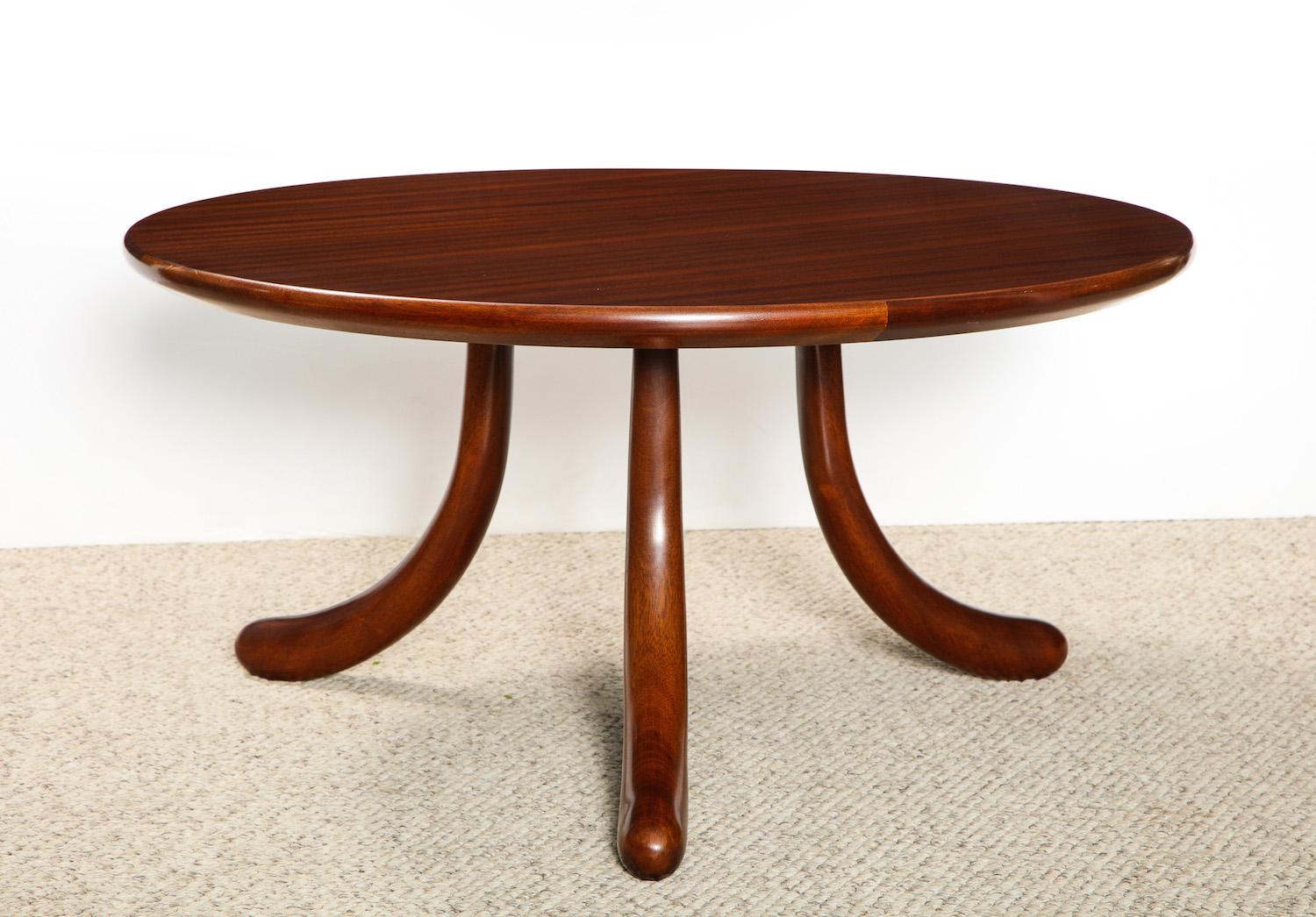 Circular table of solid mahogany. Unusual 3-legged design with rounded details and reverse tapering to each leg.