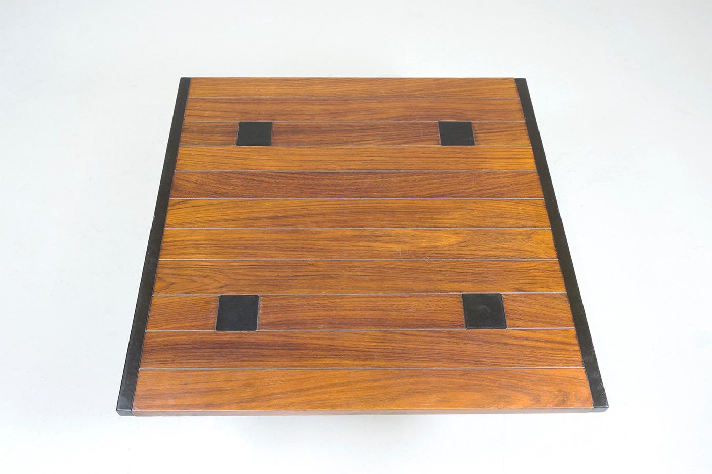 Wood and black lacquered metal
Dimensions: 77 x 77 H. 38.5cm
Design Ettore Sottsass, 1957
Manufacturer / Poltronova Italy
Stamped at the bottom 'Polrronova'.


