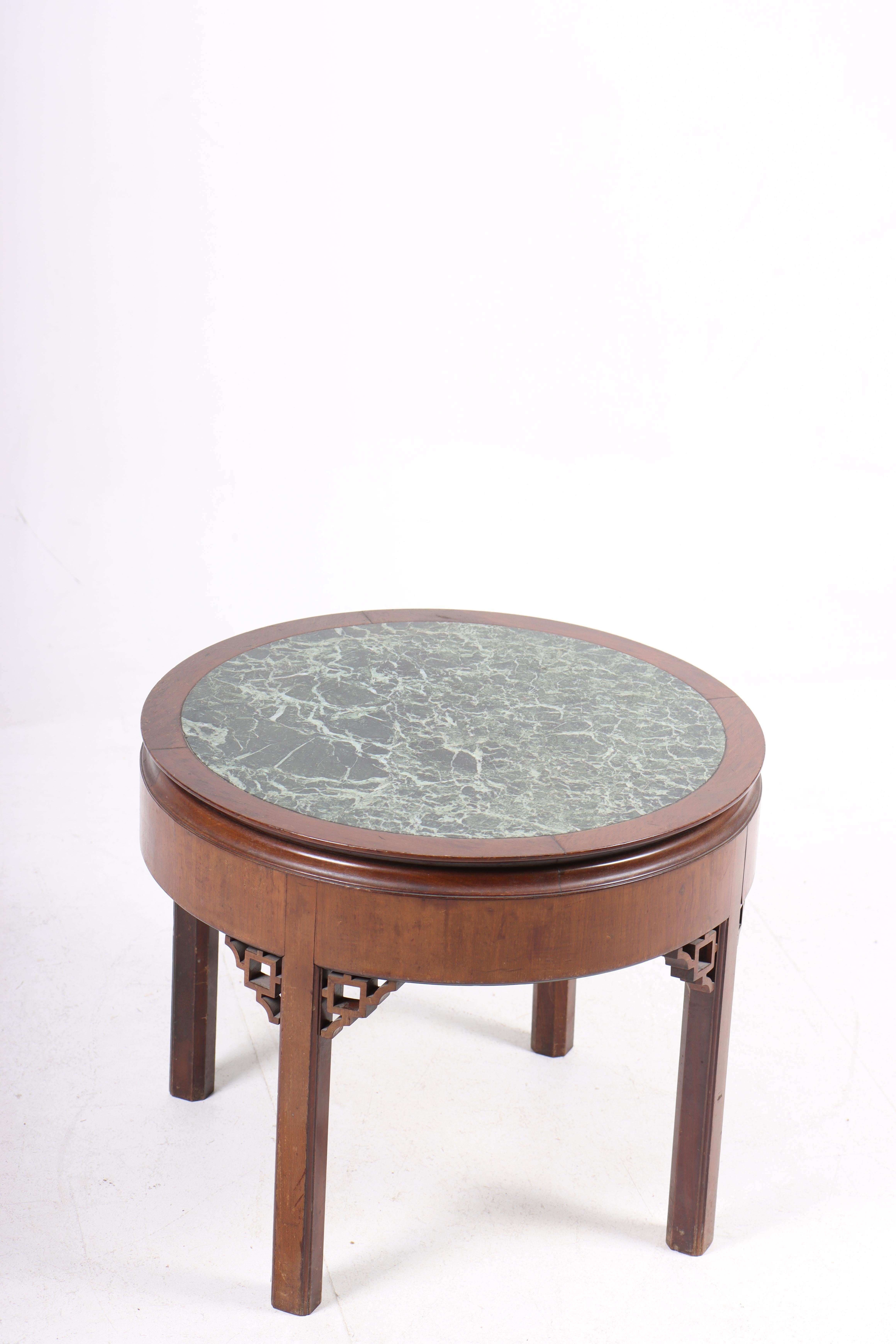 Low table in mahogany and marble top, designed and made in Denmark. Great original condition, circa 1930s.