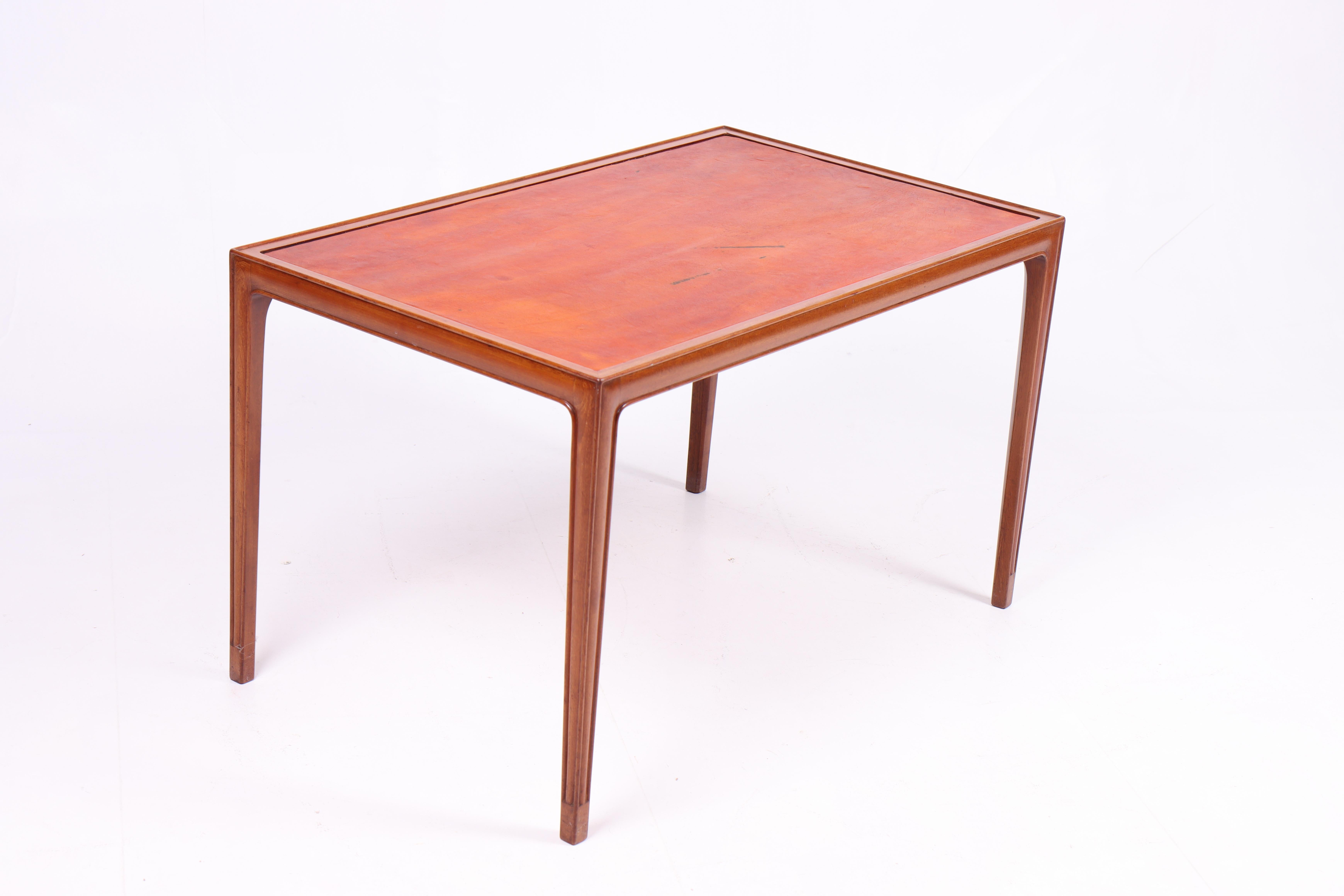 Scandinavian Modern Low Table in Mahogany and Patinated Leather, Danish Cabinetmaker 1950s For Sale