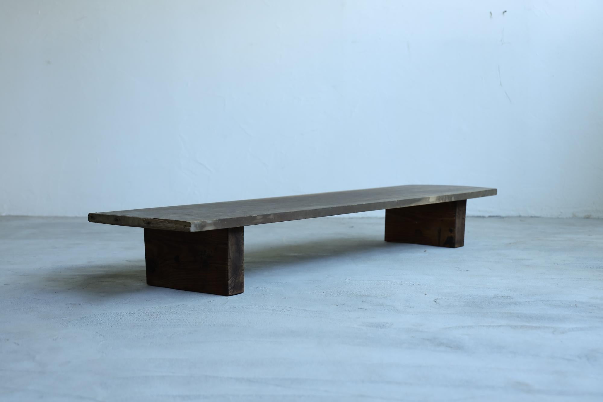 Introducing our exquisite low table, a perfect embodiment of wabi-sabi and timeless craftsmanship. Originally used as a sewing workbench, this piece carries a rich history of meticulous handiwork.

The tabletop is crafted from a single slab of