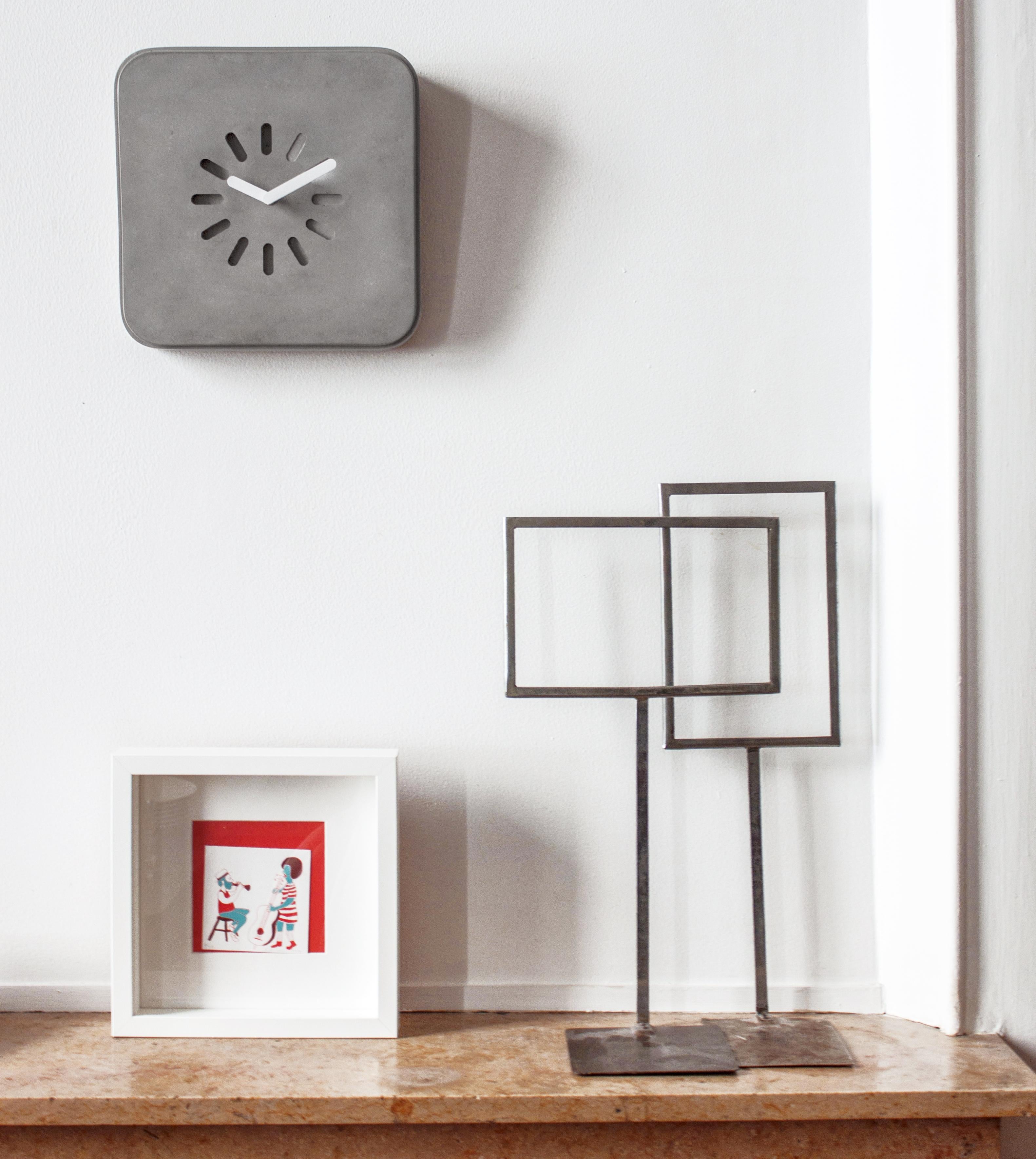 Wall-mounted or stand concrete clock.

The concrete clock « LIFE IN PROGRESS » by designer Bertrand Jayr can just stand on shelf or be hanged on any wall.
The integrated fixing system allows a simple and invisible hanging for a very sleek look.