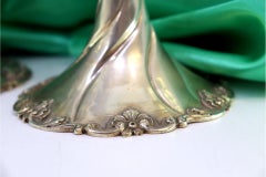 Low three-light silver candelabrum with acanthus stems on shell bases