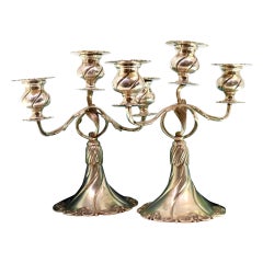 Low three-light silver candelabrum with acanthus stems on shell bases