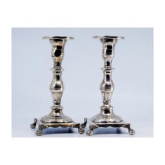 Low turned silver candlesticks with hex shafts & four claw feet