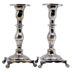 Low turned silver candlesticks with hex shafts & four claw feet