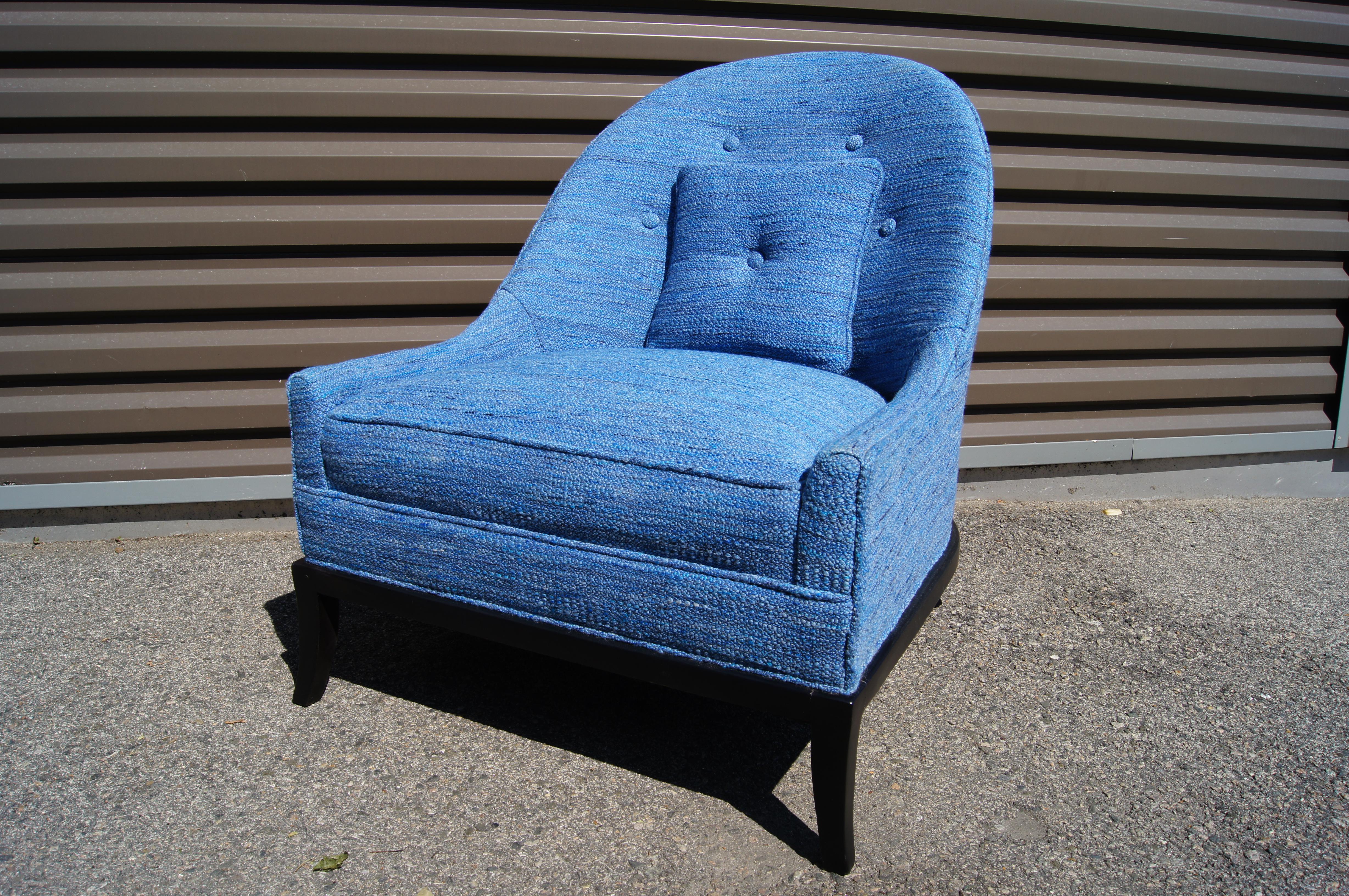 Designed by Robsjohn Gibbings model 2043, this comfortable armchair features a wide low seat and a curvaceous tufted back. The chair was previously reupholstered in Knoll's Rivington textile in Sapphire, K1080/2.