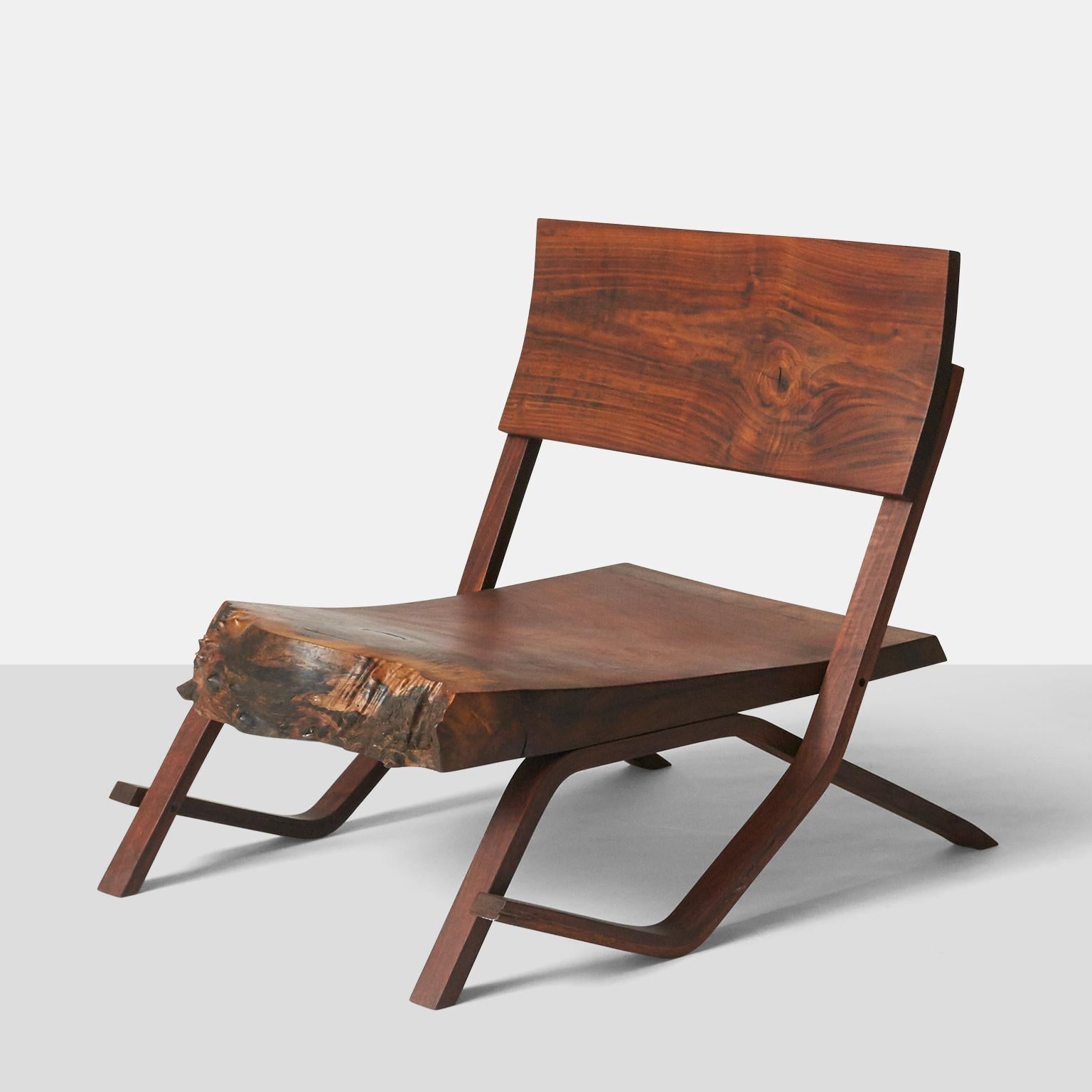 One of a kind Josh Duthie low lounge chair in solid walnut with live edge.