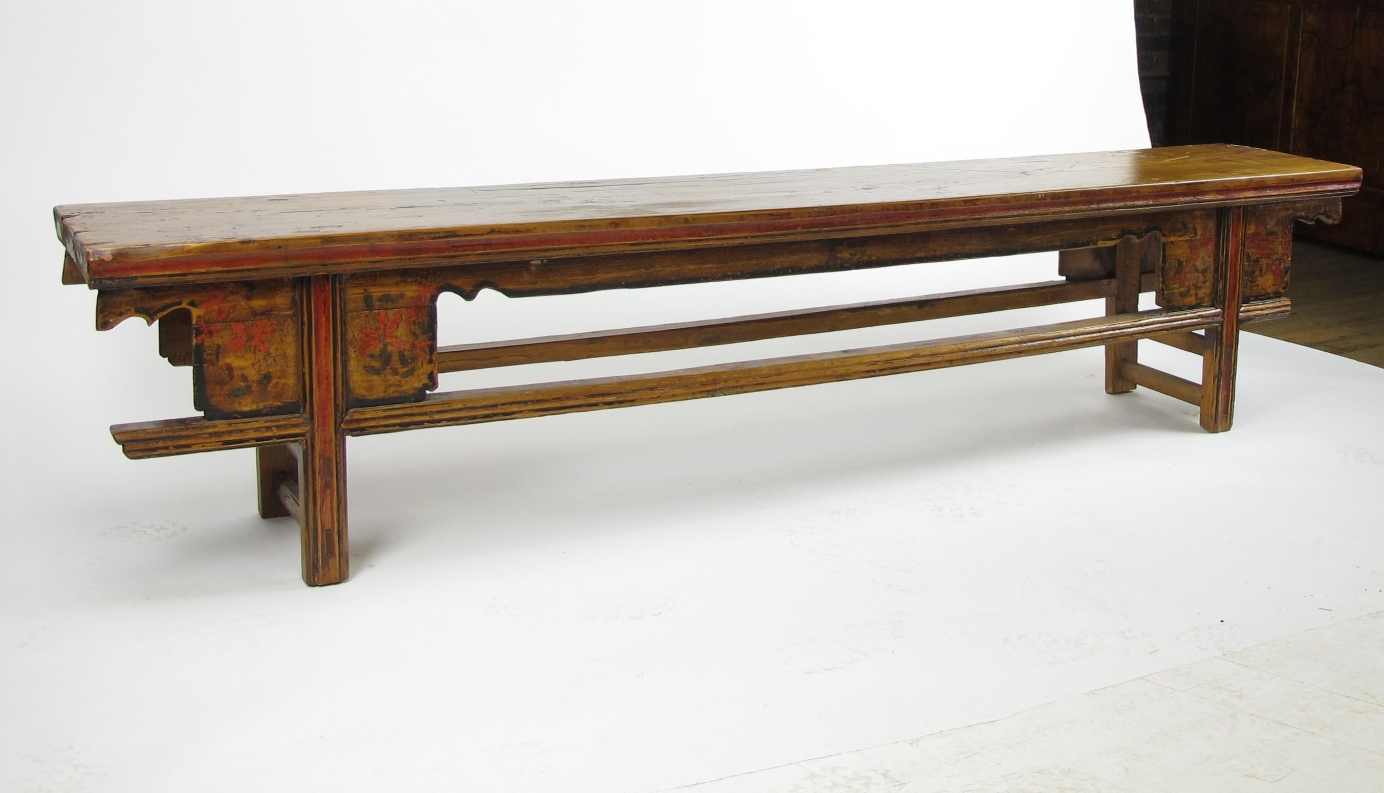 This long narrow wood table was used as a bench by a farmer’s family from the village in Gansu Province, measuring 72.8 in length, 12.2 in width, and 20.9 in height. The top of this bench was made of one solid piece of elm, showing nicely aged warm