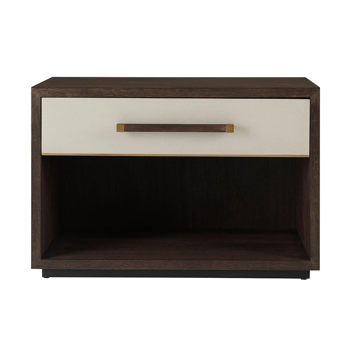 With a singular leather-wrapped soft closing drawer, a case finished in our dark Cardamon finish with a long modern handle with brushed brass details.

Dimensions: 30