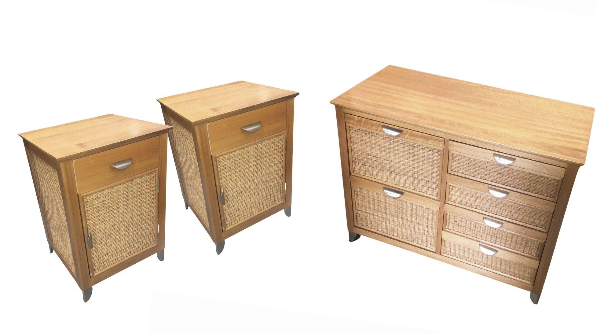 Wicker lowboy dresser and set of nightstands in a tropical mid-century style. These pieces feature a metal pull handle and are made in a medium oak color wood.

Dimensions
Dresser: Height: 30.5