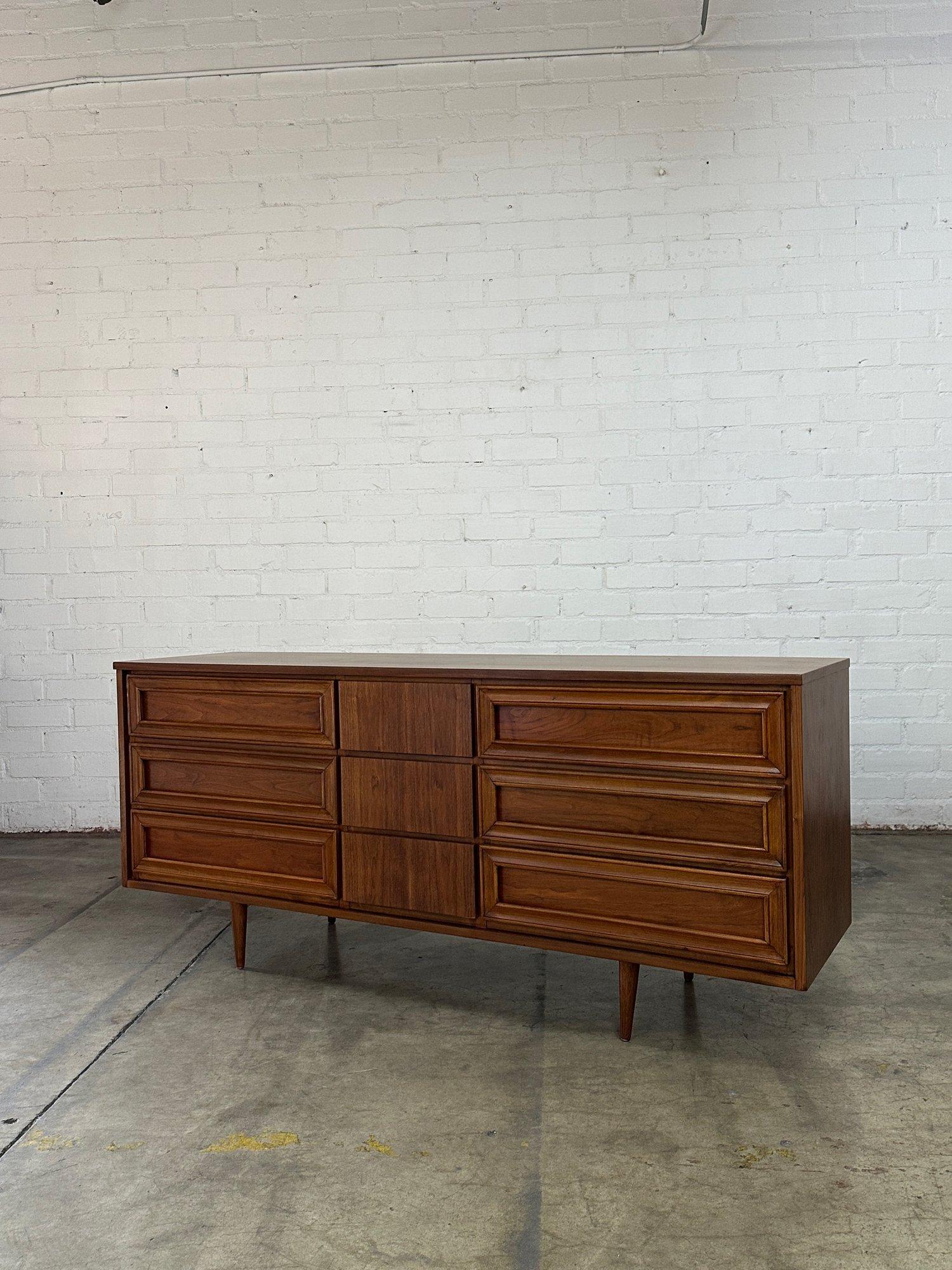 W70 D19 H30

Fully restored lowboy dresser circa 1960s. Item shows well with no visible areas of wear, item is structurally sound and fully functional . Item features hidden pulls on the center drawers and outer drawers have encased drawers that