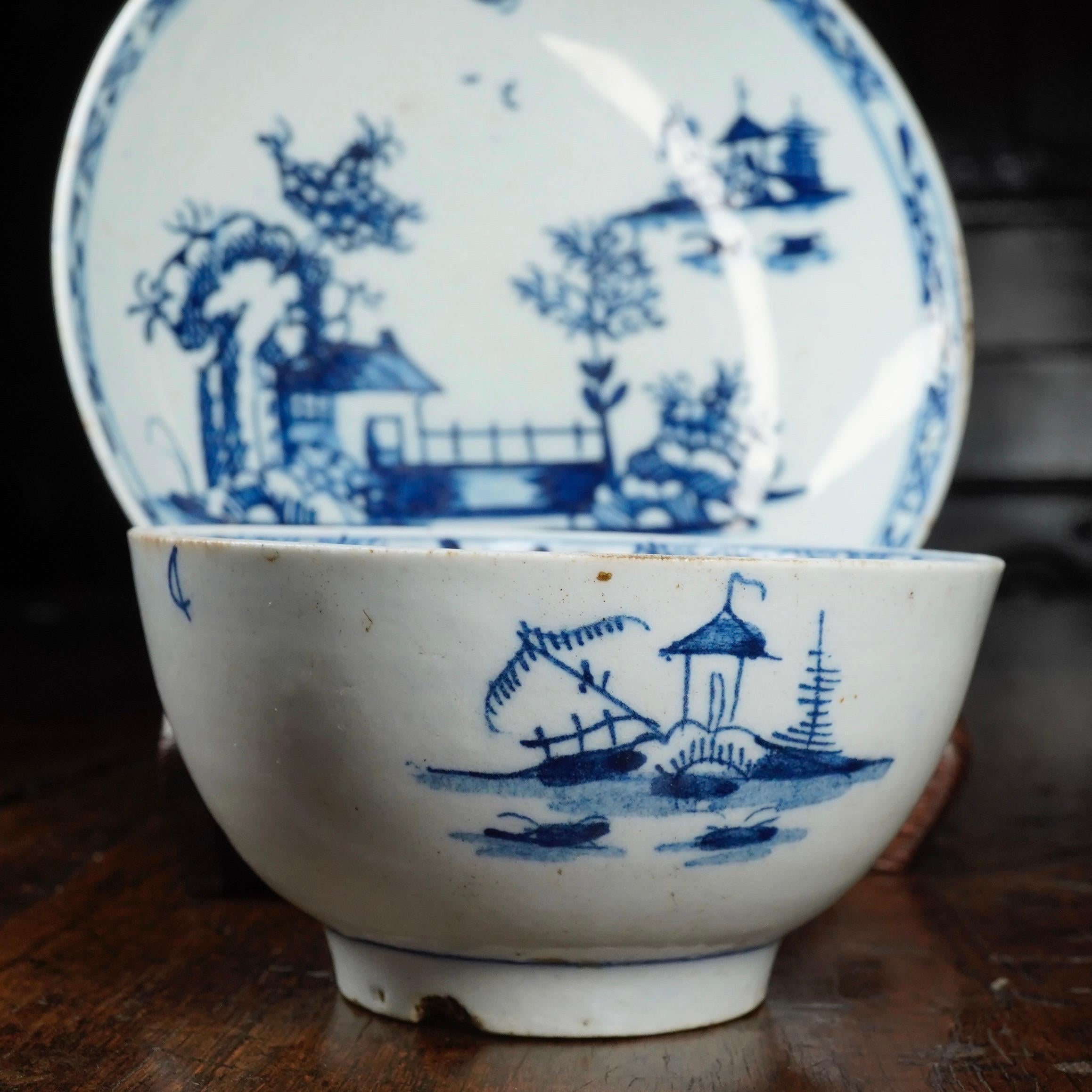 Lowestoft teabowl and saucer, painted in underglaze blue with a delightful chinoiserie pattern, the 'Long Bridge'. 

Unmarked, circa 1760.