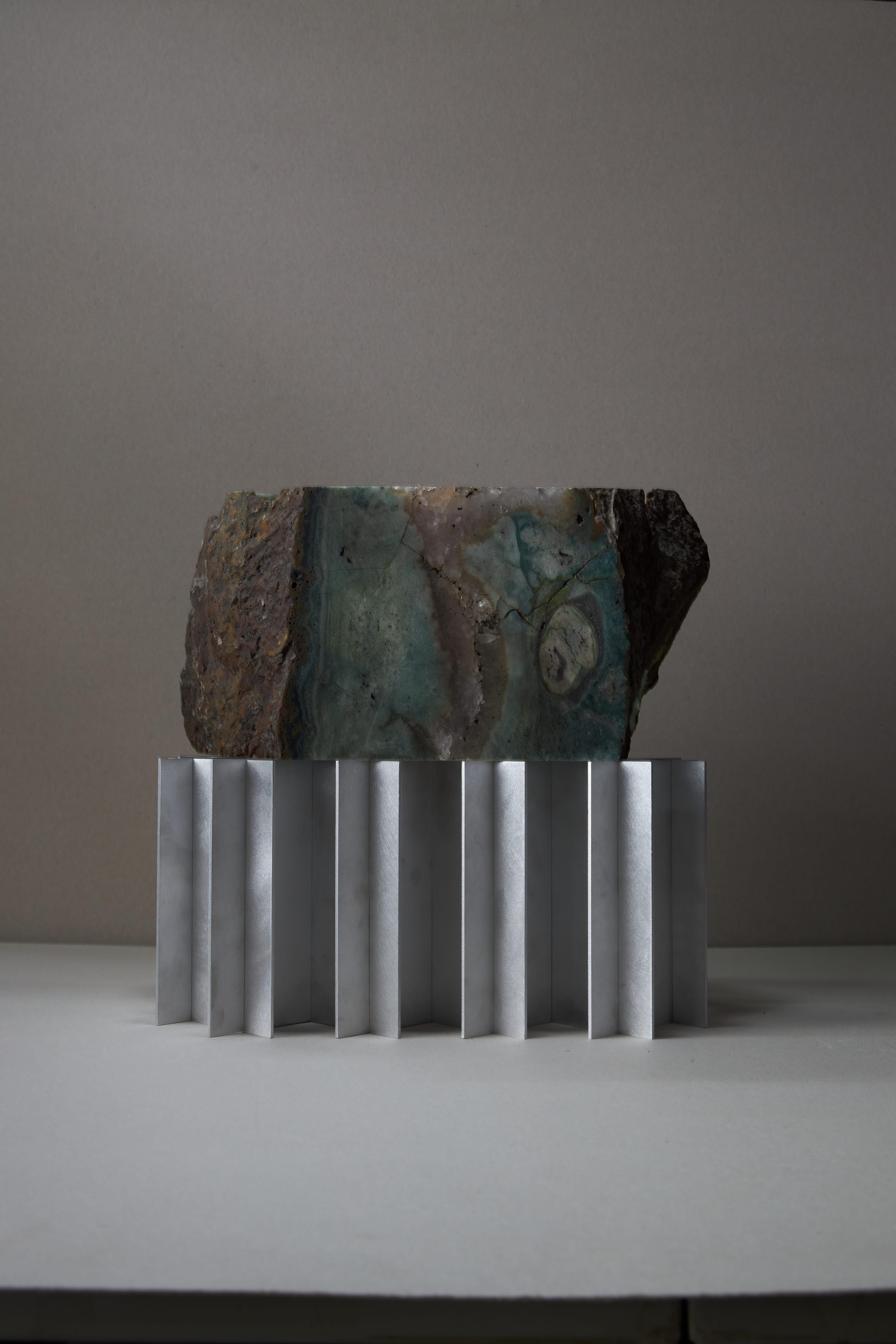 Introducing the LOX Lamp, a masterpiece of modern design and craftsmanship. This double luminaire features a stunning shade made from jasper and recycled quartz, radiating a unique blend of natural beauty and contemporary elegance. 

The base,