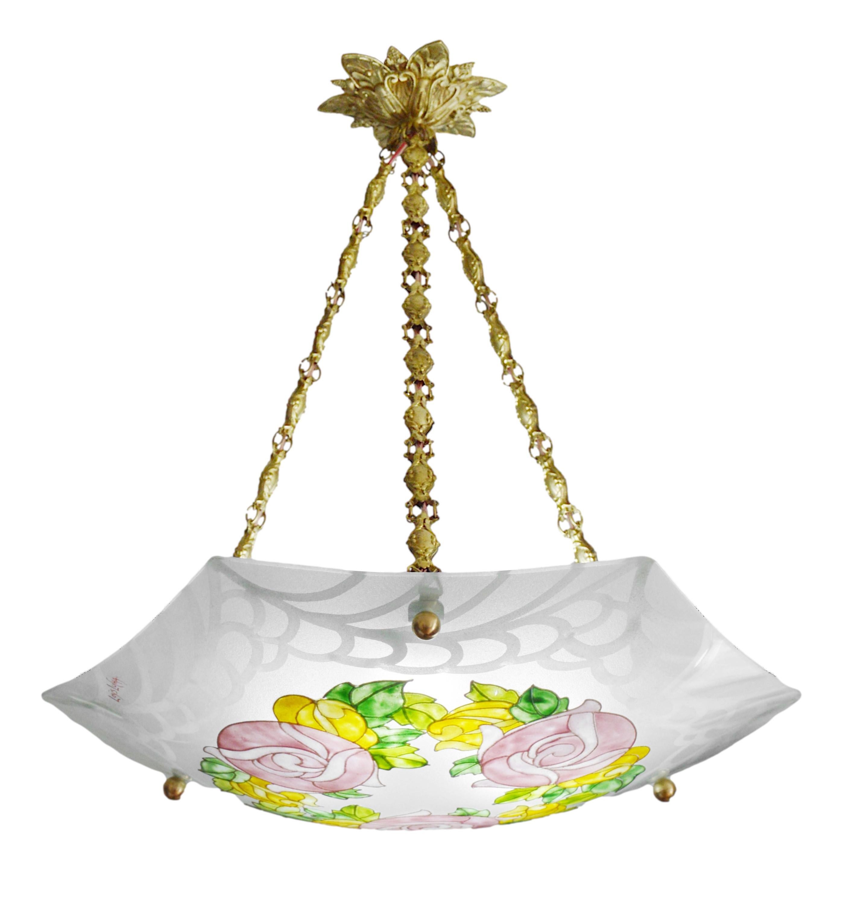 French Art Deco pendant chandelier by Loys Lucha (Paris), France, 1920s. Etched (edge) and enameled (pattern) glass shade hung at its bronze and stamped brass fixture. Measures: height: 17