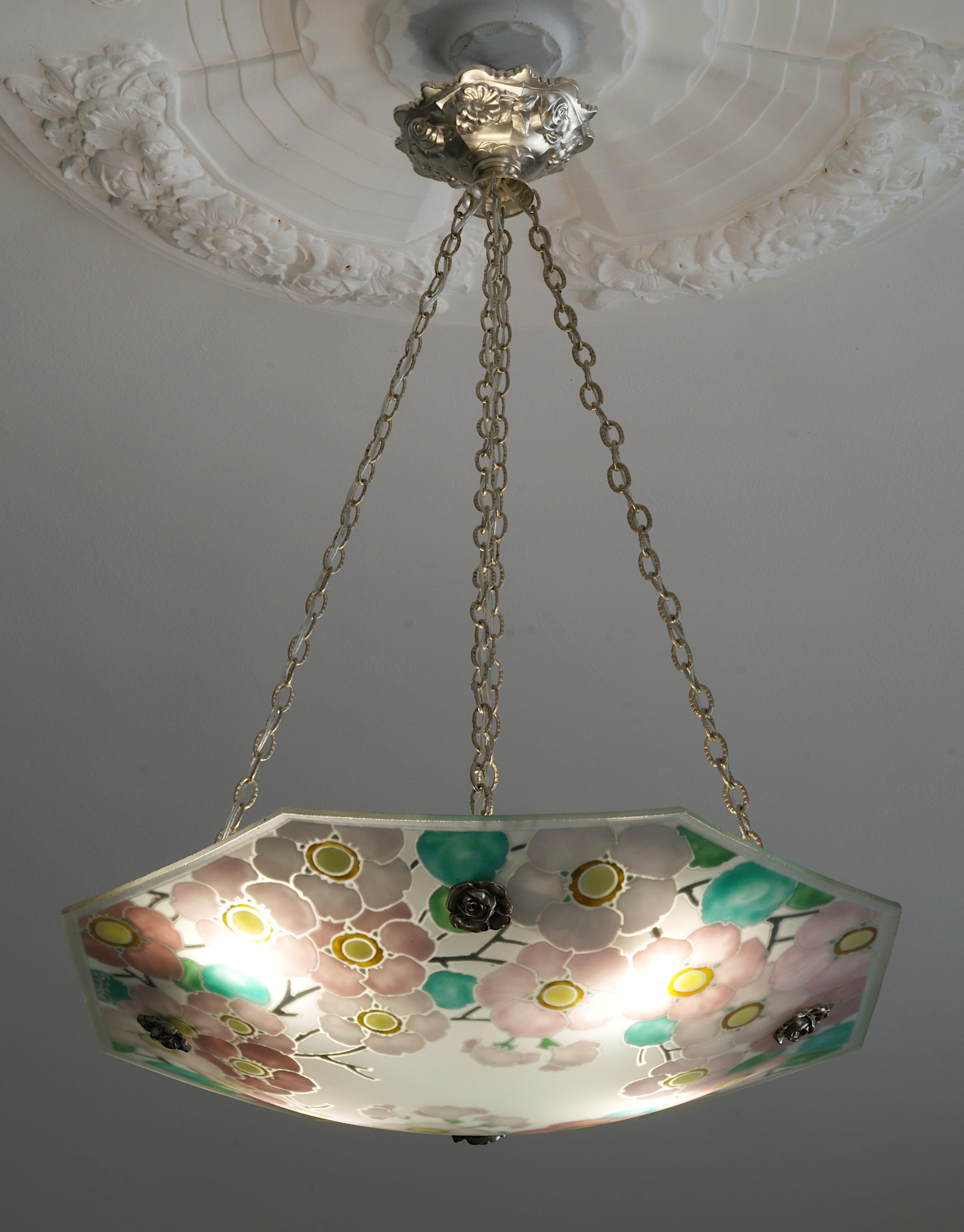 French Art Deco pendant chandelier by Loys Lucha (Paris), France, 1920s. Etched (edge) and enameled (pattern) glass shade hung at its period stamped brass fixture. Enamelled on the upper side. Measure: Height : 22