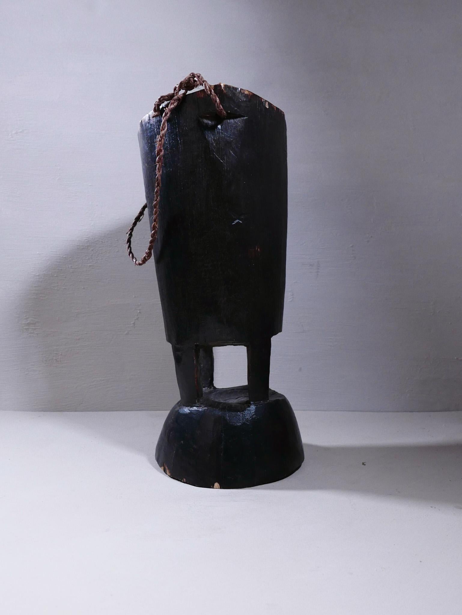 The Loss people of Zambia are known for their basketry and rarely work in wood, but their wooden milk jugs are sought after objects from collectors. Originally used to collect milk from cows. This particular jug comes with a rope handle. 
