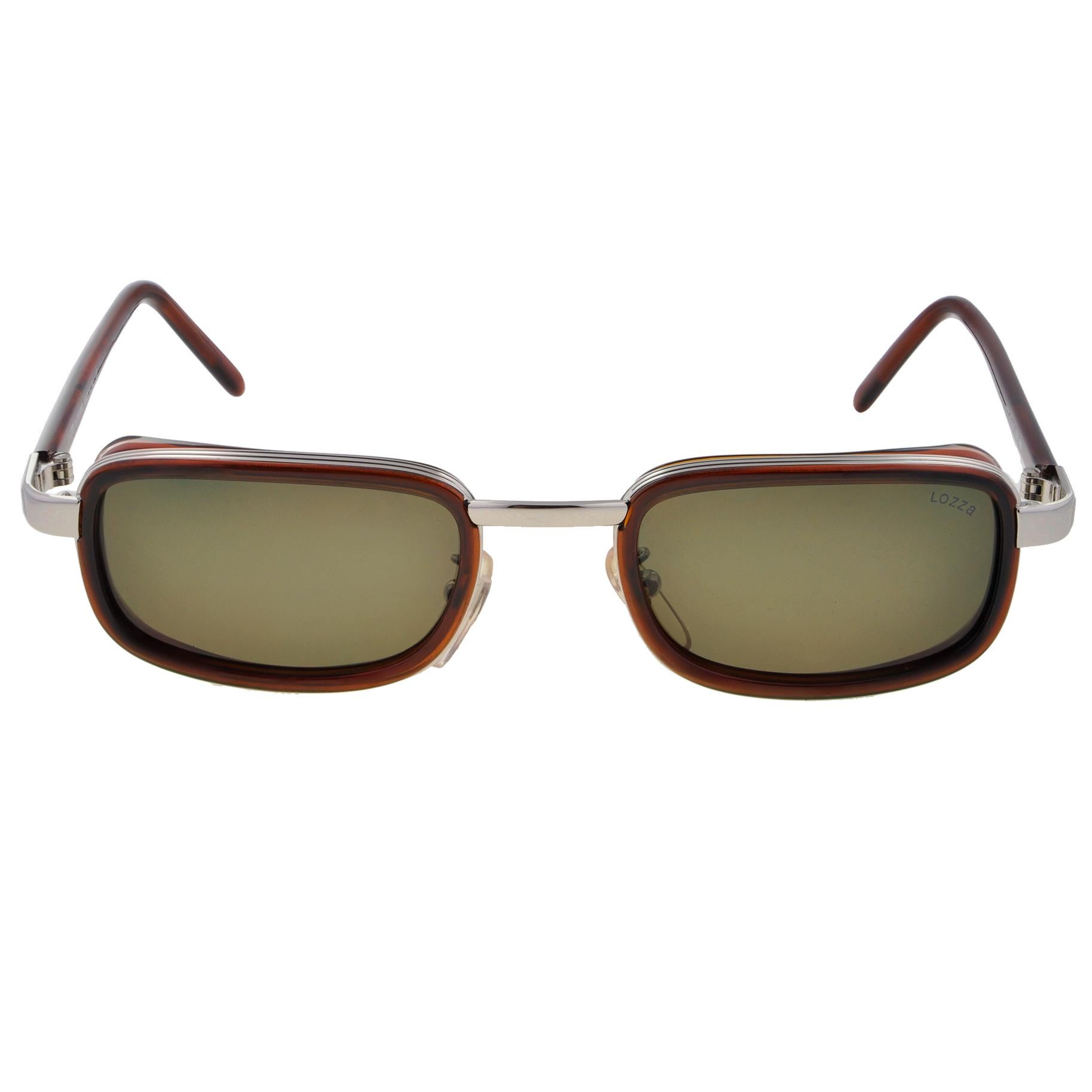MARCA: Lozza
MODELO: 1137 - 958
HECHO EN: Italia
ERA: Años 80
ESTADO: Nuevo stock antiguo [nunca usado].

DIMENSIONES:
Anchura del objetivo: 50 mm  
Altura de la lente: 32 mm  
Puente: 18 mm  
Anchura de templo a templo: 145 mm 

COLORES:
Marco: